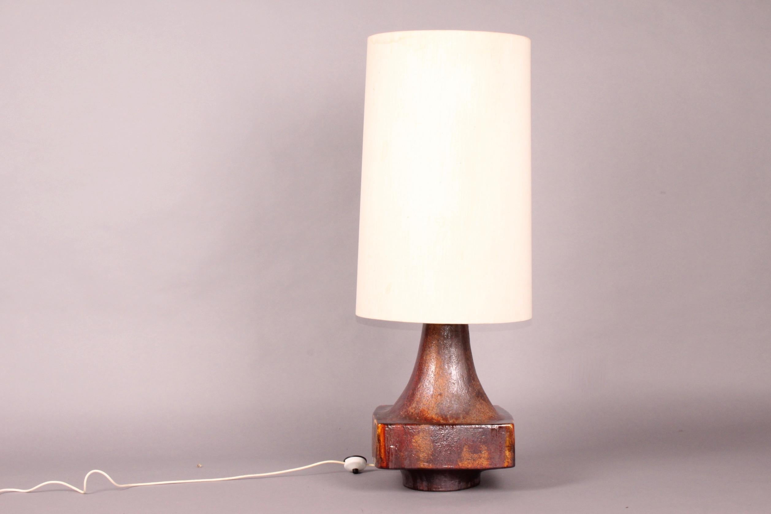 Big ceramic table lamp, some stain on the shade, see photo, dimensions without shade H 130 cm. 37 by 37 cm.