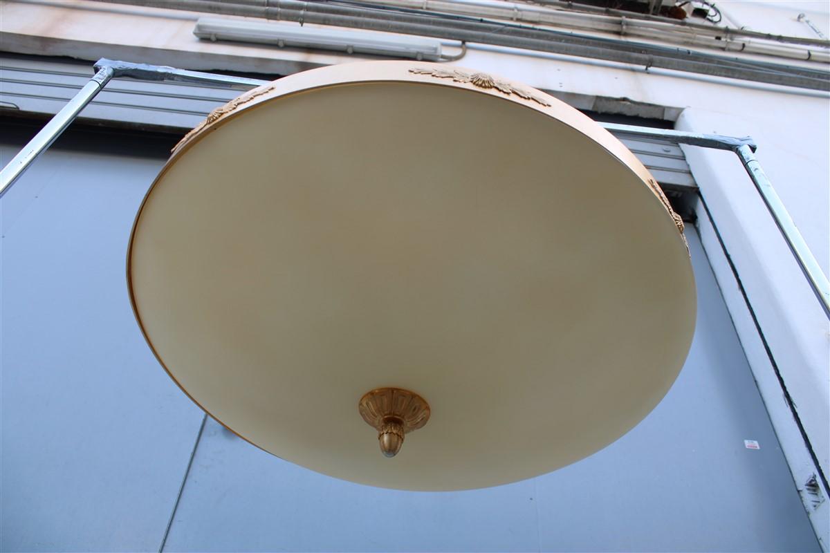 Big classic round Italian chandelier brass gold yellow glass Italian design 1970.
6 light bulbs max 80 was each.