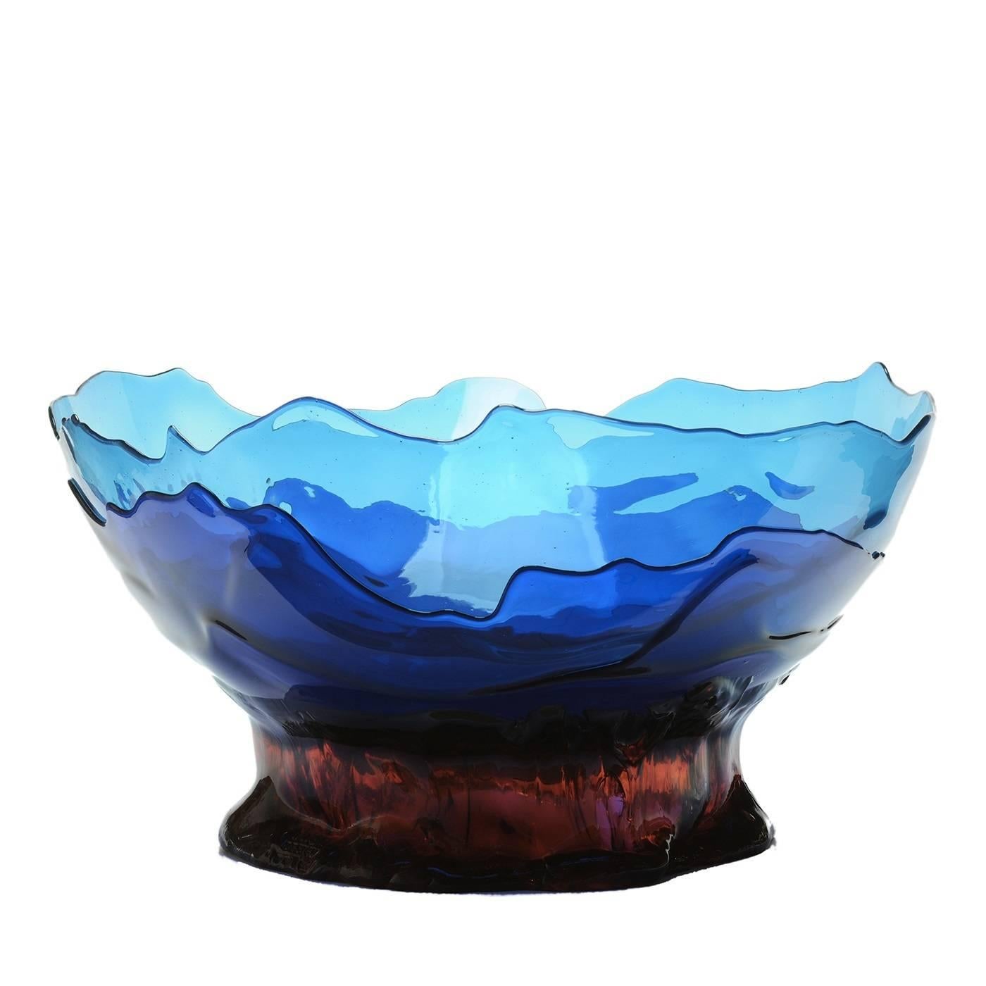 Part of the Big Collina Extracolor series designed by Gaetano Pesce in 1995 for the Fish Design collection, this piece is a versatile addition to a contemporary home. Its large bowl, made of several irregular layers of blue soft resin, can display