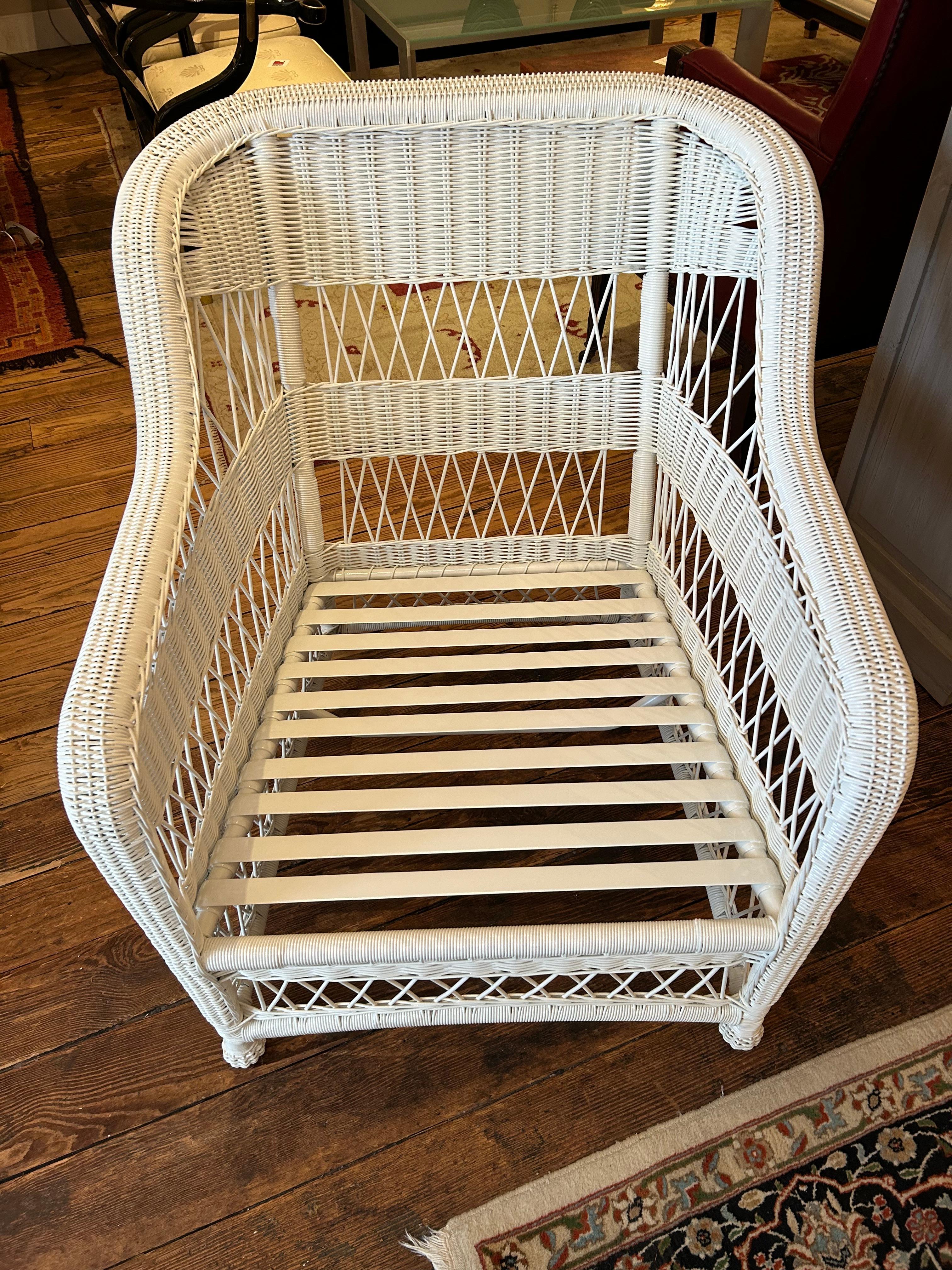 Oversized classic white wicker club chair, heavy and well constructed, having big comfy custom cushions.  3 are available.