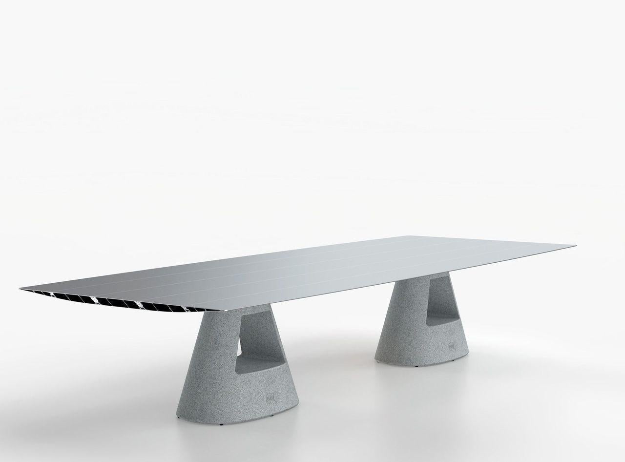 Big concrete table B by Konstantin Grcic
Dimensions: D 150 x W 360 x H 74 cm 
Materials: Tabletop in extrusioned aluminium with open ends cut at 45º. There is the option of the surface being laminated in a natural oak effect with a varnished