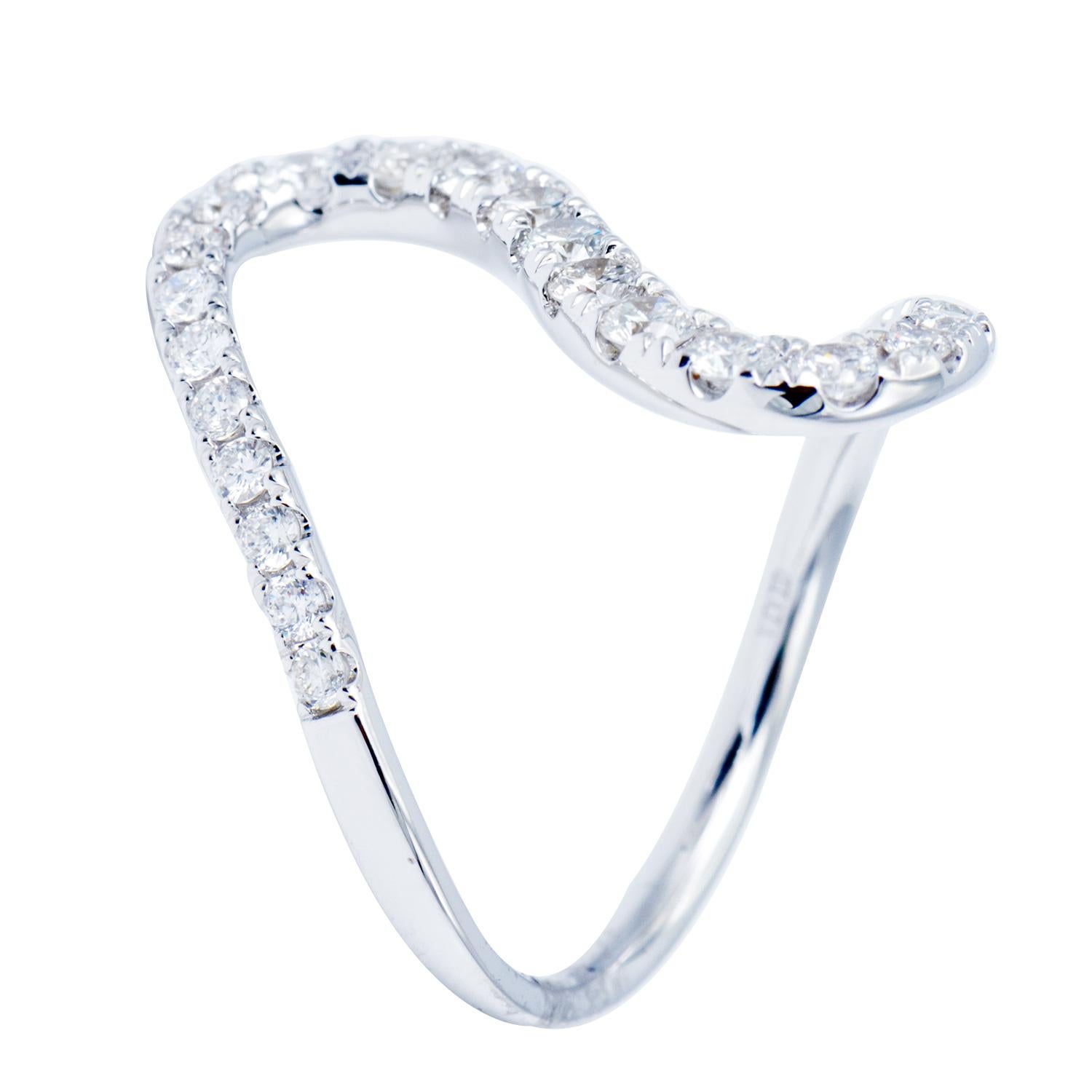 This fun and unique ring is made of 27 round VS2, G color diamonds totaling 0.79 carats which are beautifully set in 3.3 grams of 18 karat white gold. This ring makes a beautiful curve on the finger and is a very modern and fashionable piece. This
