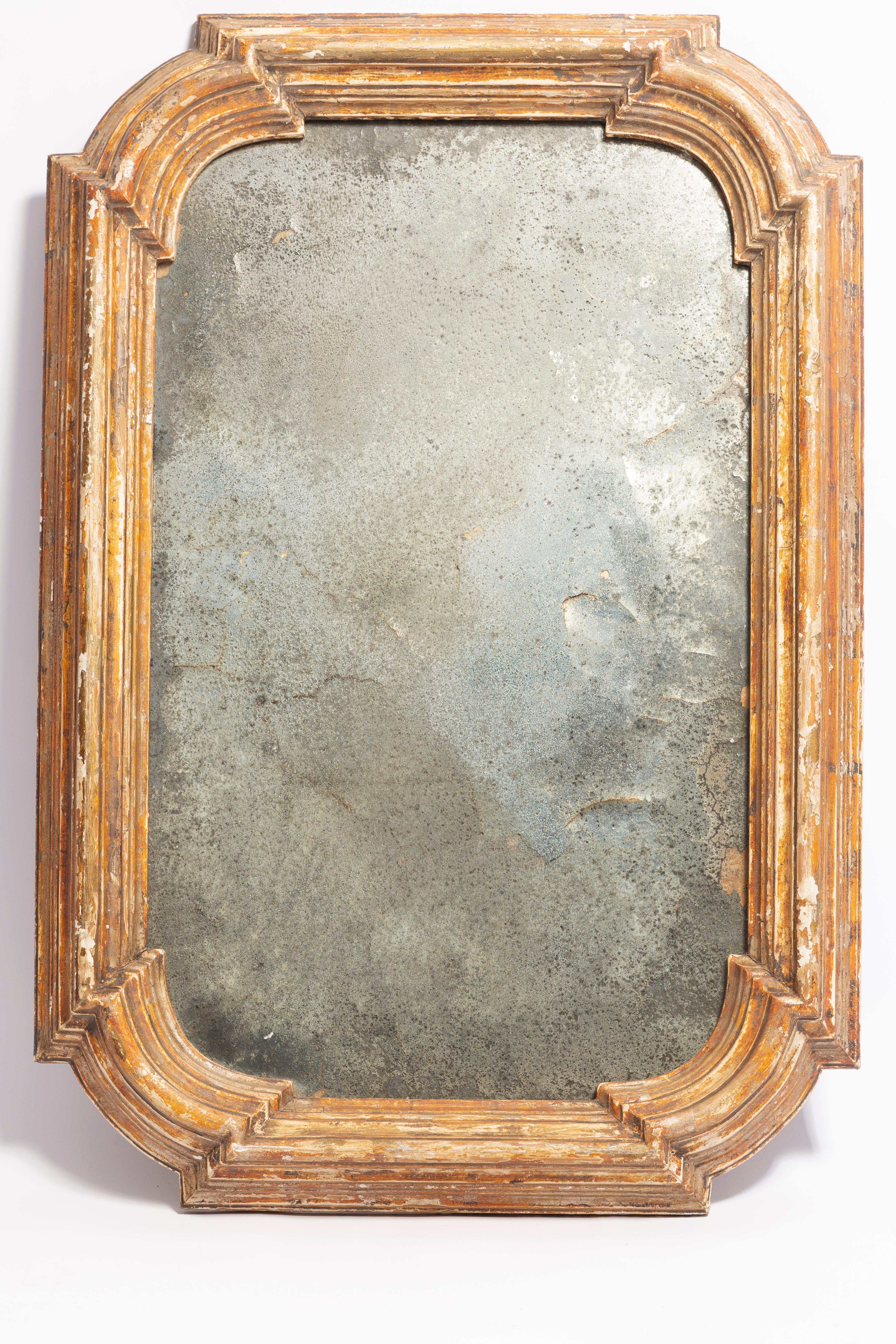 Beautiful mirror in a golden decorative frame from Italy. The frame is made of wood. Mirror is in very good vintage condition. Original glass. Amazing patina. Beautiful piece for every interior! Only one unique piece.