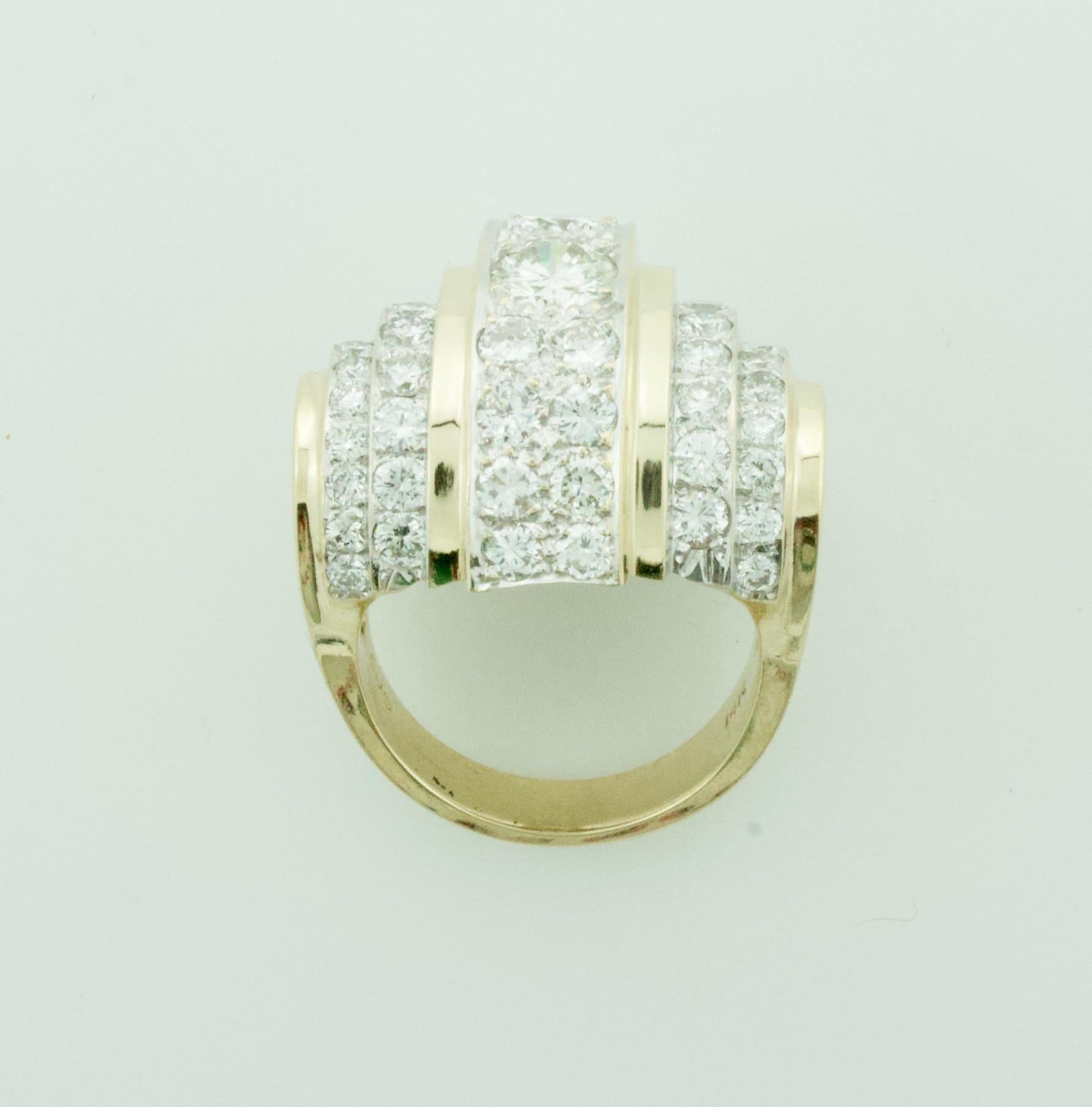 Big Diamond Diamond Ring in Yellow Gold Circa 1960's 3.40 cts.
2 Round Brilliant Cut Diamonds Weighing 1.00 Carats Approximately [Color GHI Clarity VVS-SI1]
56 Round Brilliant Cut Diamonds Weighing 2.40 Carats Approximately  [Color GHI Clarity