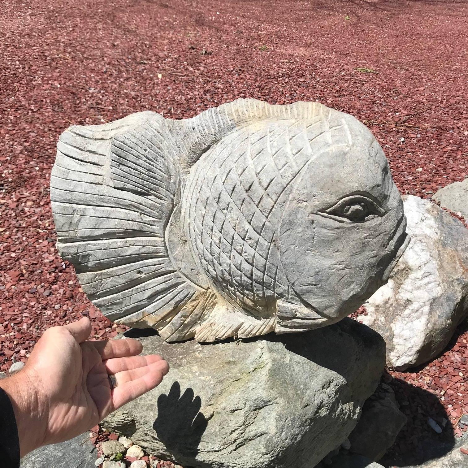 Here's a substantial and attractive hand-carved stone fish that might grace your favourite garden spot, koi pond, or indoor fisherman themed space.

This was sourced from an American garden collection this past year.

Quality: Fine smoothly carved