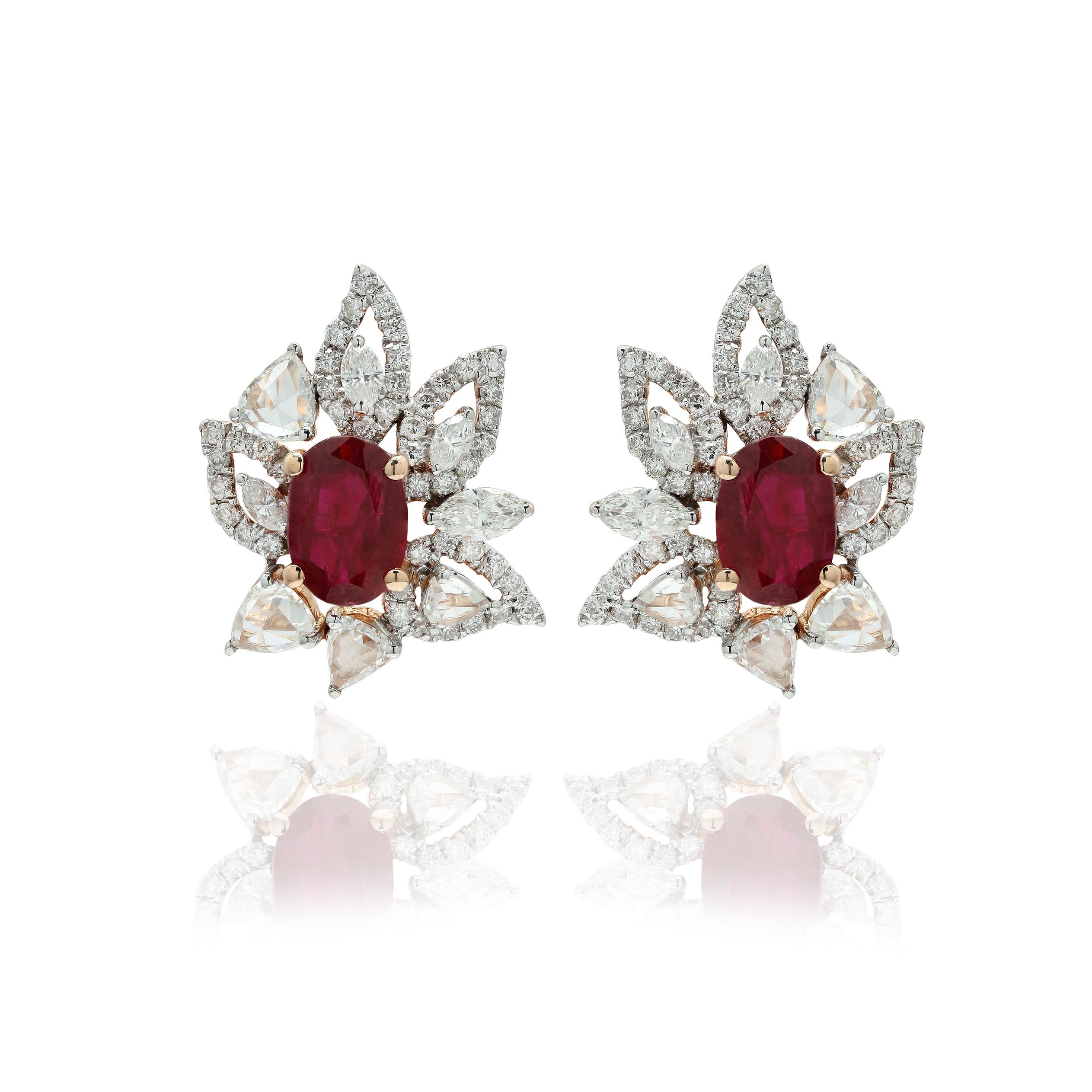Studs create a subtle beauty while showcasing the colors of the natural precious gemstones and illuminating diamonds making a statement.
Floral ruby with diamonds stud earrings in 14K gold. Embrace your look with these stunning pair of earrings