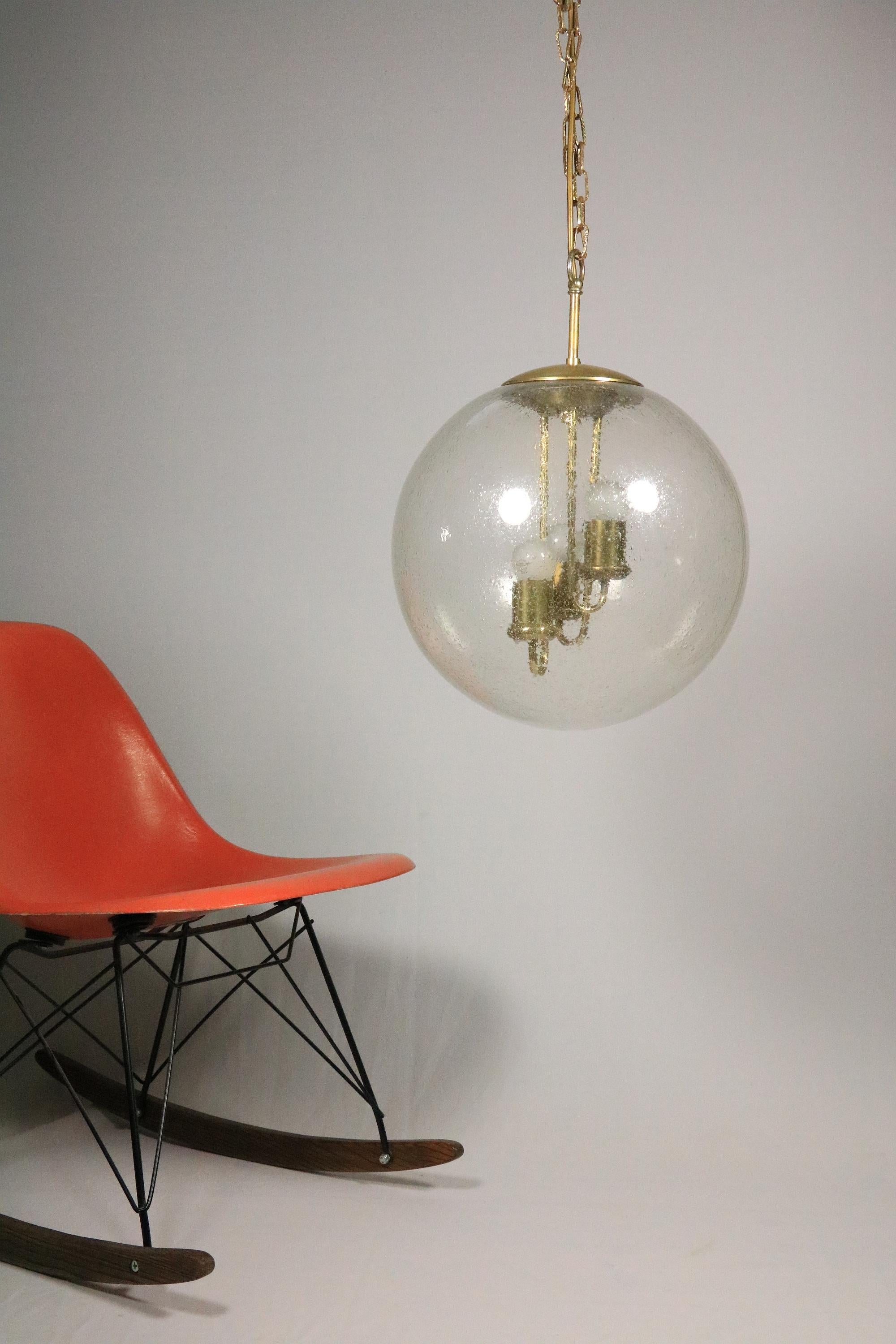 Very effective, large ball lamp made of bubble glass with brass sockets inside.

3 x E14 socket (can be used for E12 with adapters, included)
 
Manufacturer: Born Leuchten 

Diameter: 35 cm / 13.78 inches
Height: 70 cm / 27.56 inches
 
Very well