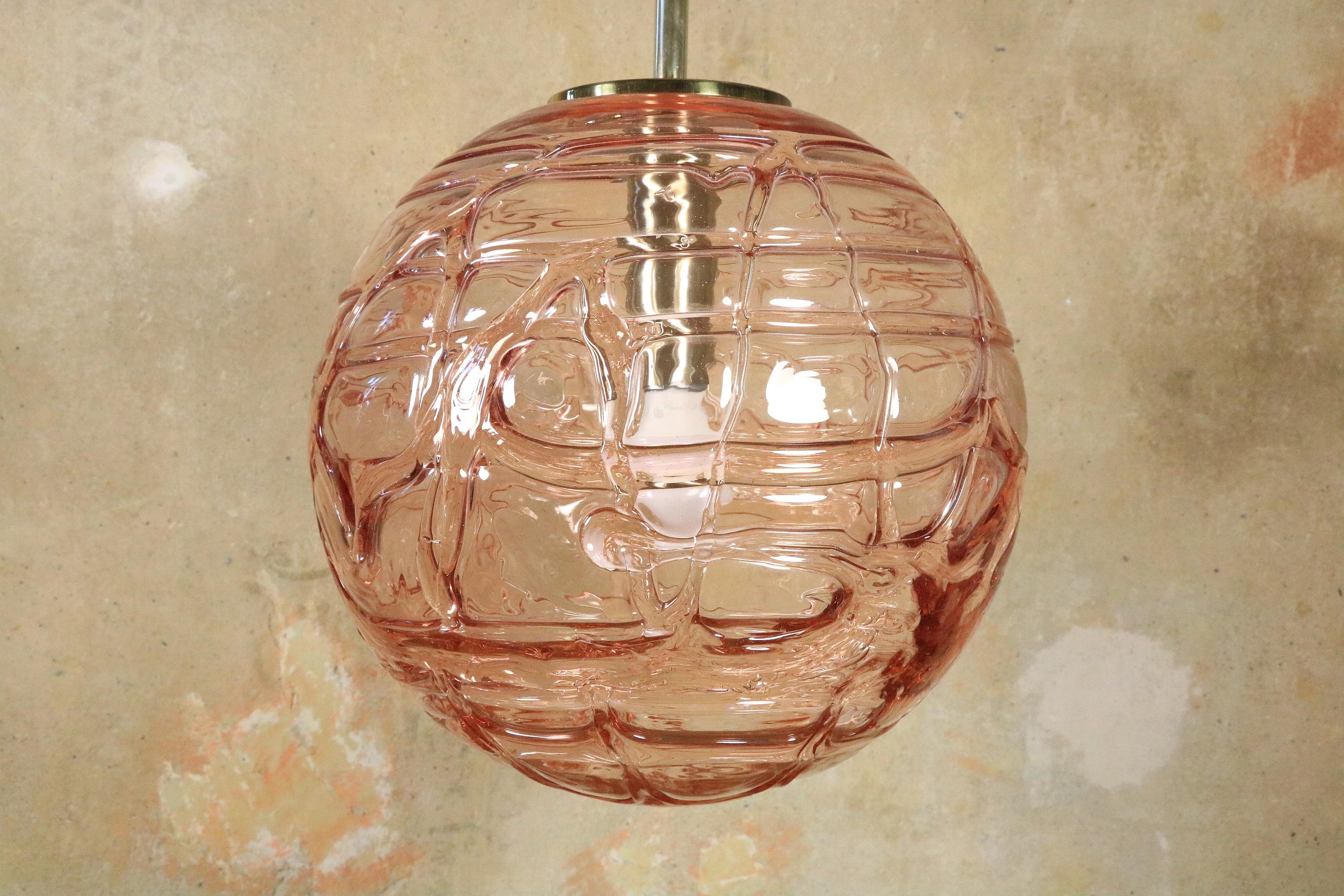 Large Murano glass ball lamp made of blown glass. 
Rare in the color pink.
On the video you can see well the noble shine of the glass.
 
Manufacturer: DORIA Leuchten, Germany
 
XL version: 35 cm / 13.8 inches diameter
Hight including cable: