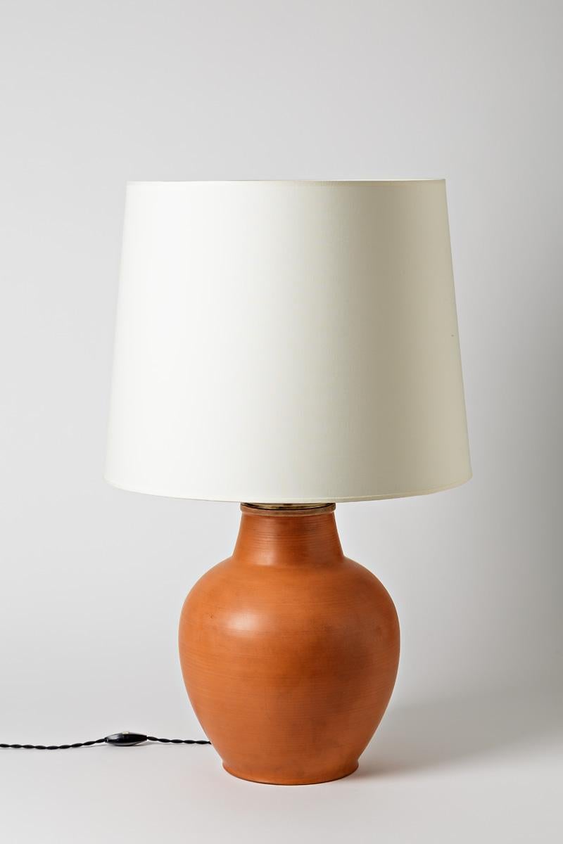 Big glazed ceramic table lamp by Pierre Roulot. Artist signature under the base. 1950.
H : 18.1 x 10.5 inches (ceramic only).
H : 14 x 10.5 inches (with electrical system).
H : 28.5 x 17.5 inches (with lampshade).
Sold with a European electrical