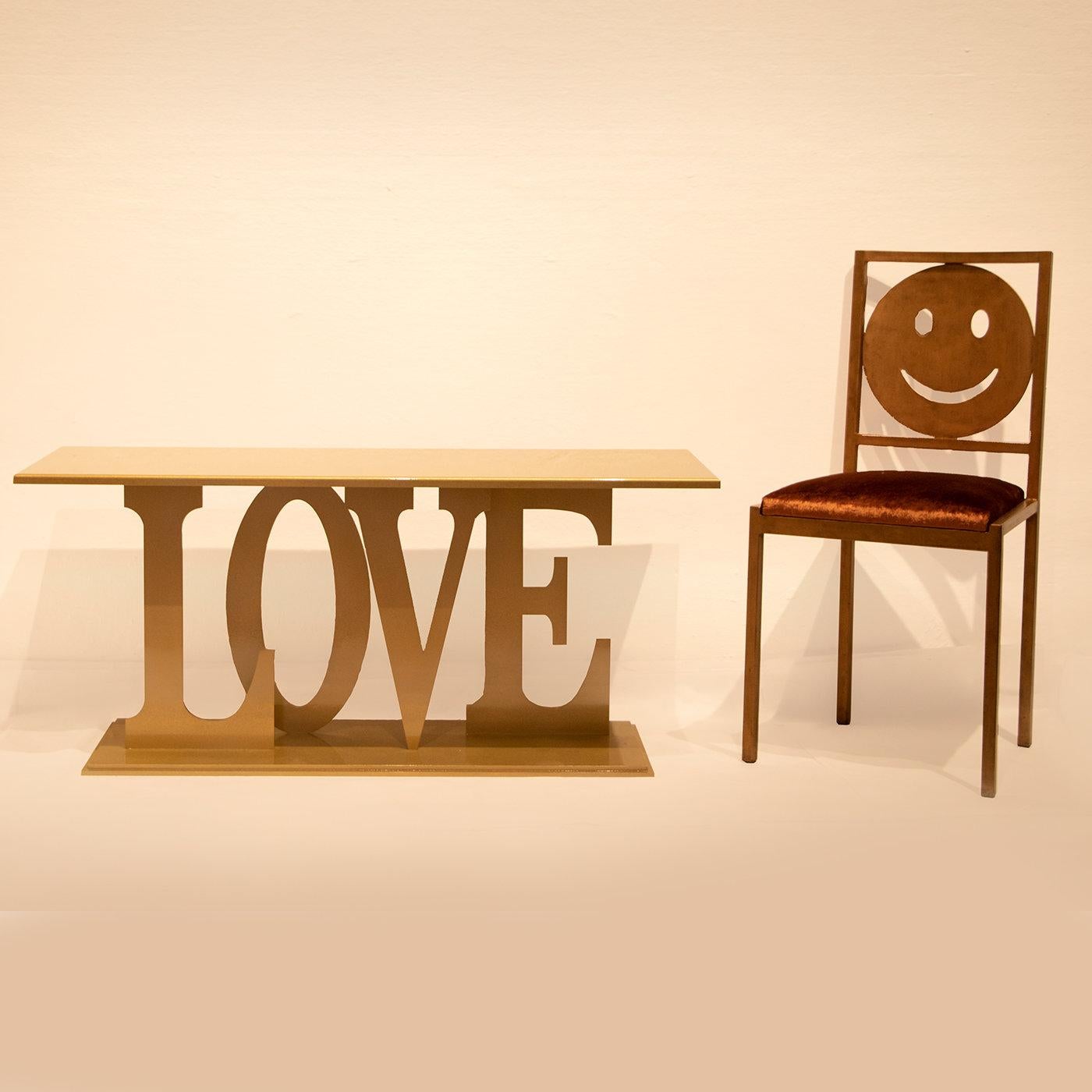 Imperfect Love Collection features chairs, coffee tables, consoles created by Giulia Ligresti characterized by a distinct, typographic design. Made by hand by skilled Italian craftsmen, this console features an iron frame with brushed gold-painted