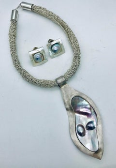 Big  Grey Blister Pearl framed in Silver matching Pearl earring  Sylvia Gottwald