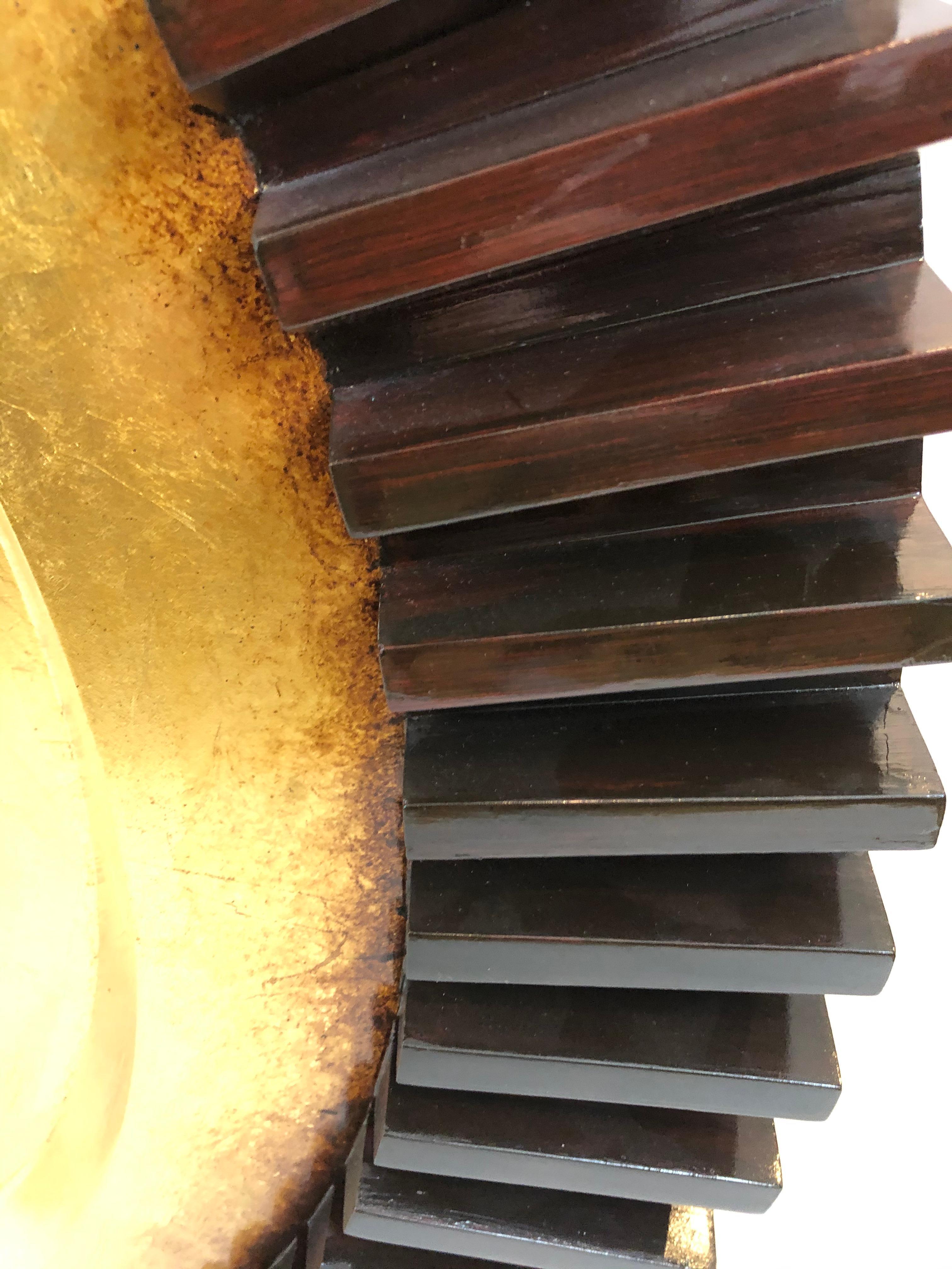 An eye poppingly cool big round carved wood industrial style 