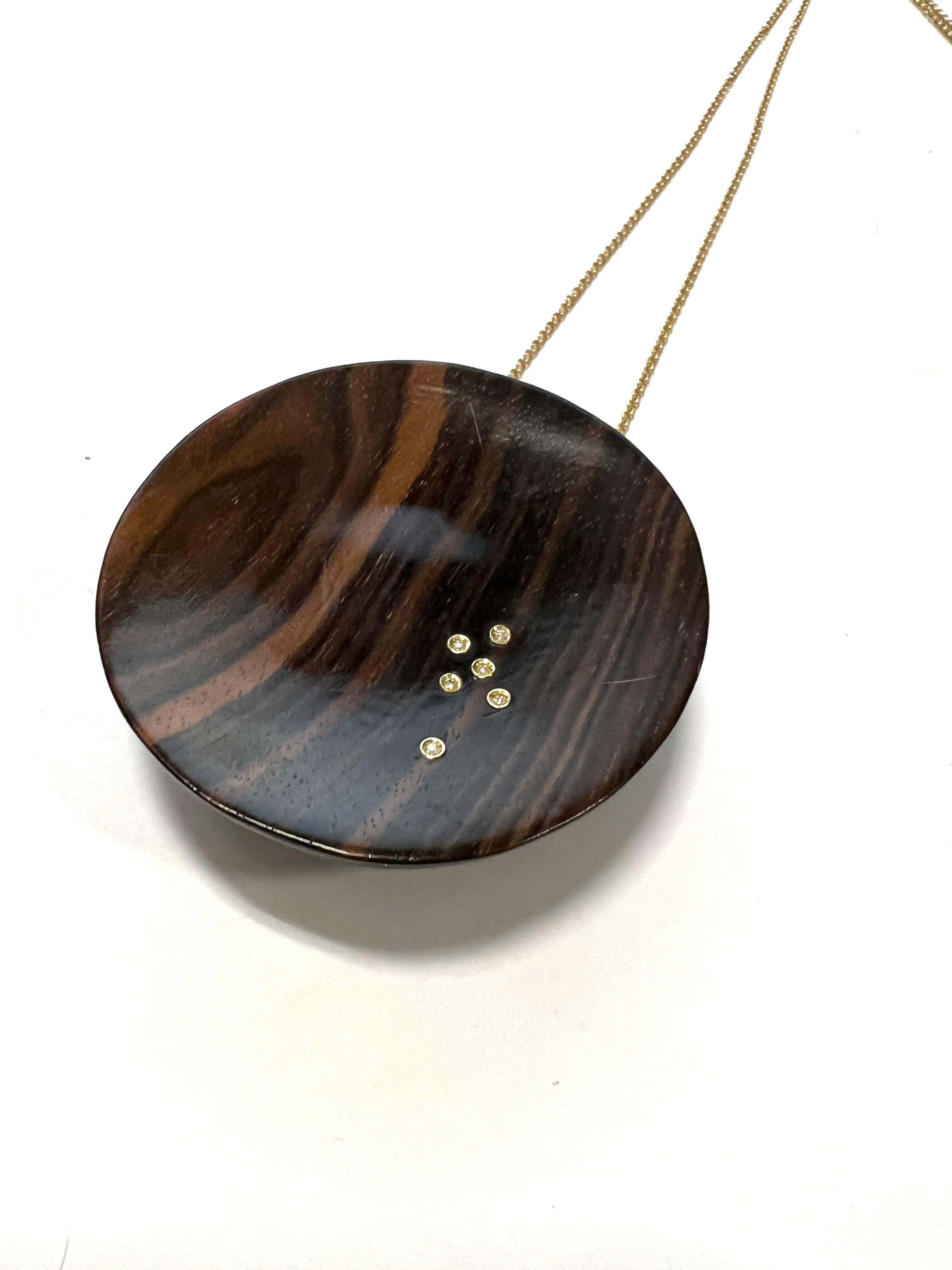 Big Full Concave Half Sphere Rosewood Pendant  And Diamonds On 18K Yellow Gold Necklace.
Rosewood is an elegant and precious wood and this pendant is embellished by a 6 diamonds.

Tot weight gr. 51.9
Gold weight gr. 11.5
6 Diamond GVVS ct.0,06
Chain