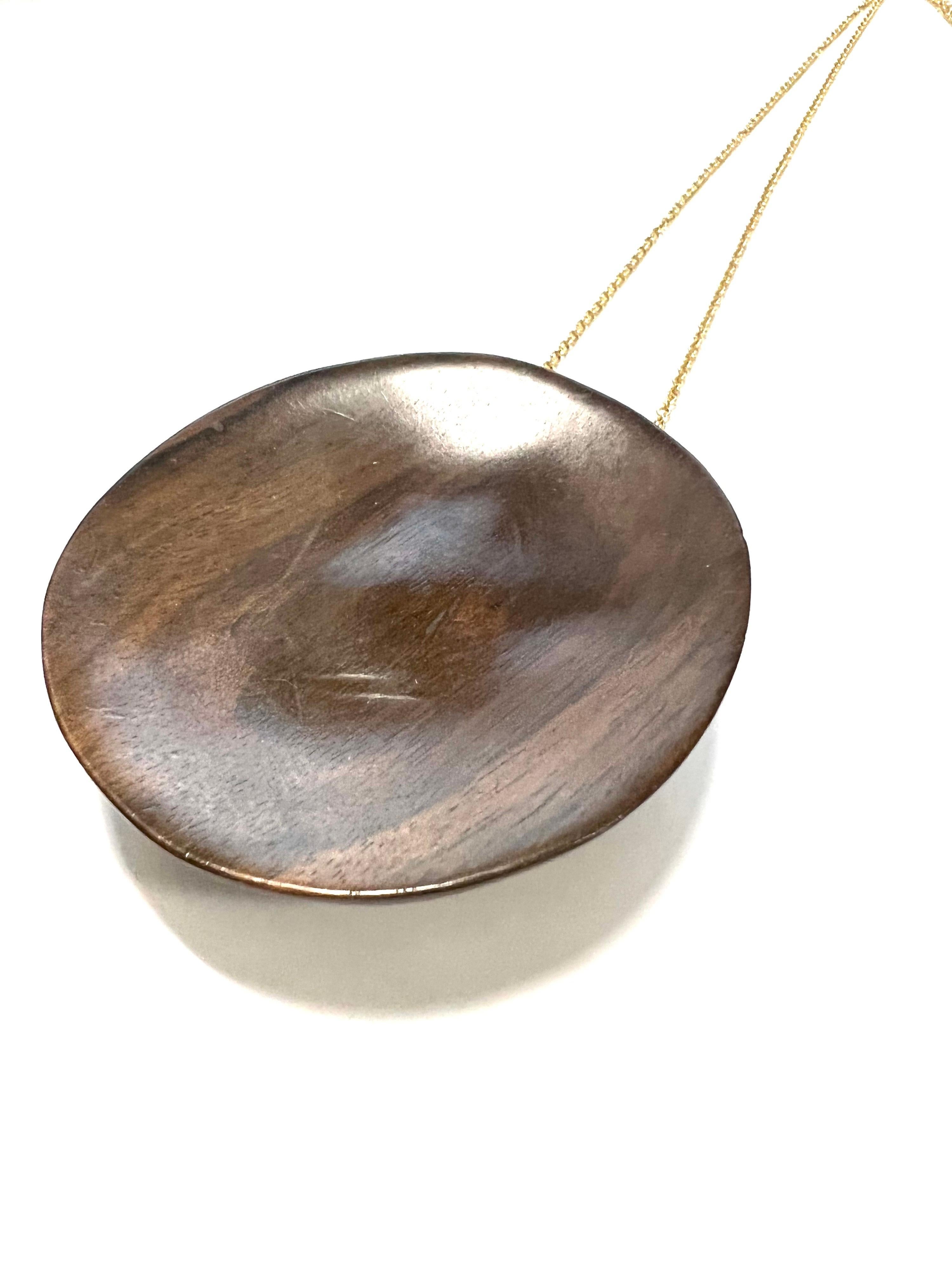 Big Full Concave Half Sphere Rosewood Pendant  On 18K Yellow Gold Necklace.
Rosewood is an elegant and precious wood.

Tot weight gr. 49
Gold weight gr. 12.4
Chain length cm.96
Micheletto's nameplate is on the back in 18k Yellow gold
with the STAMP