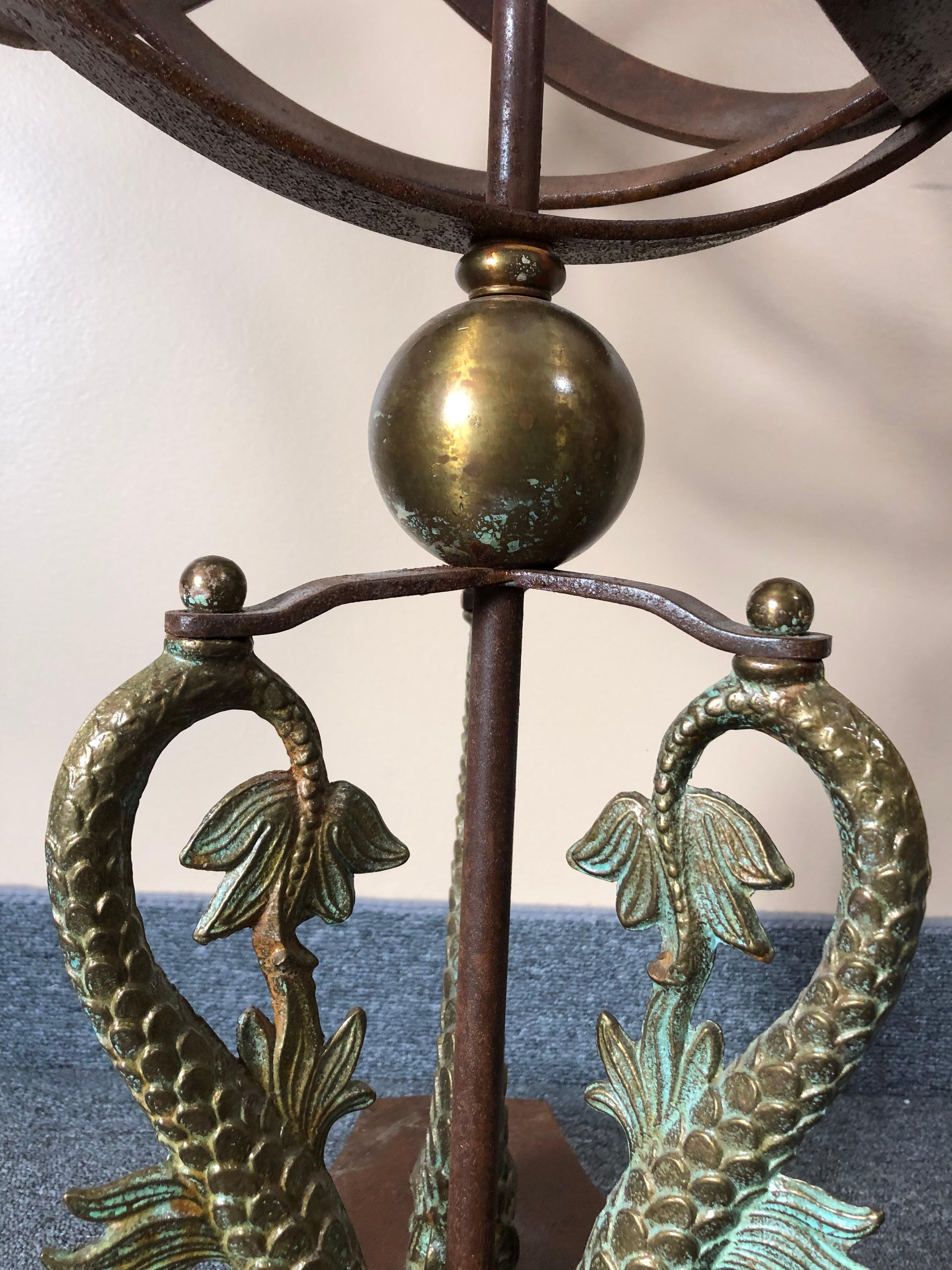 A big impressive iron armillary sculpture having a rust colored aged patina and verdigris dolphins adorning the base.
Diameter of sphere 17.5
Bases is 16.25 diameter.