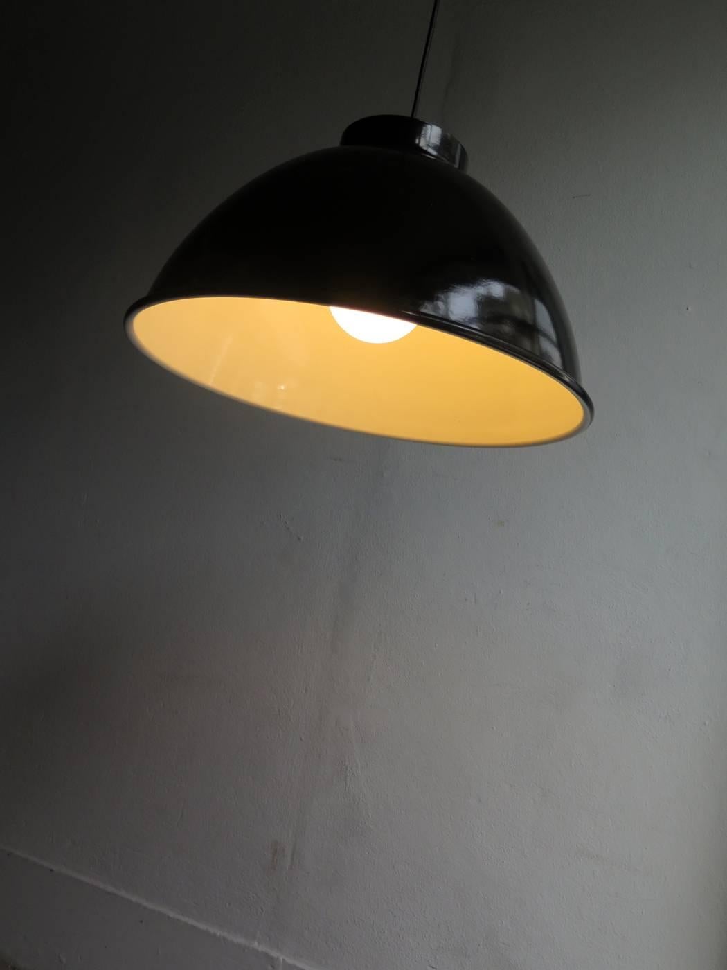 Big industrial black and white pendant lamps.