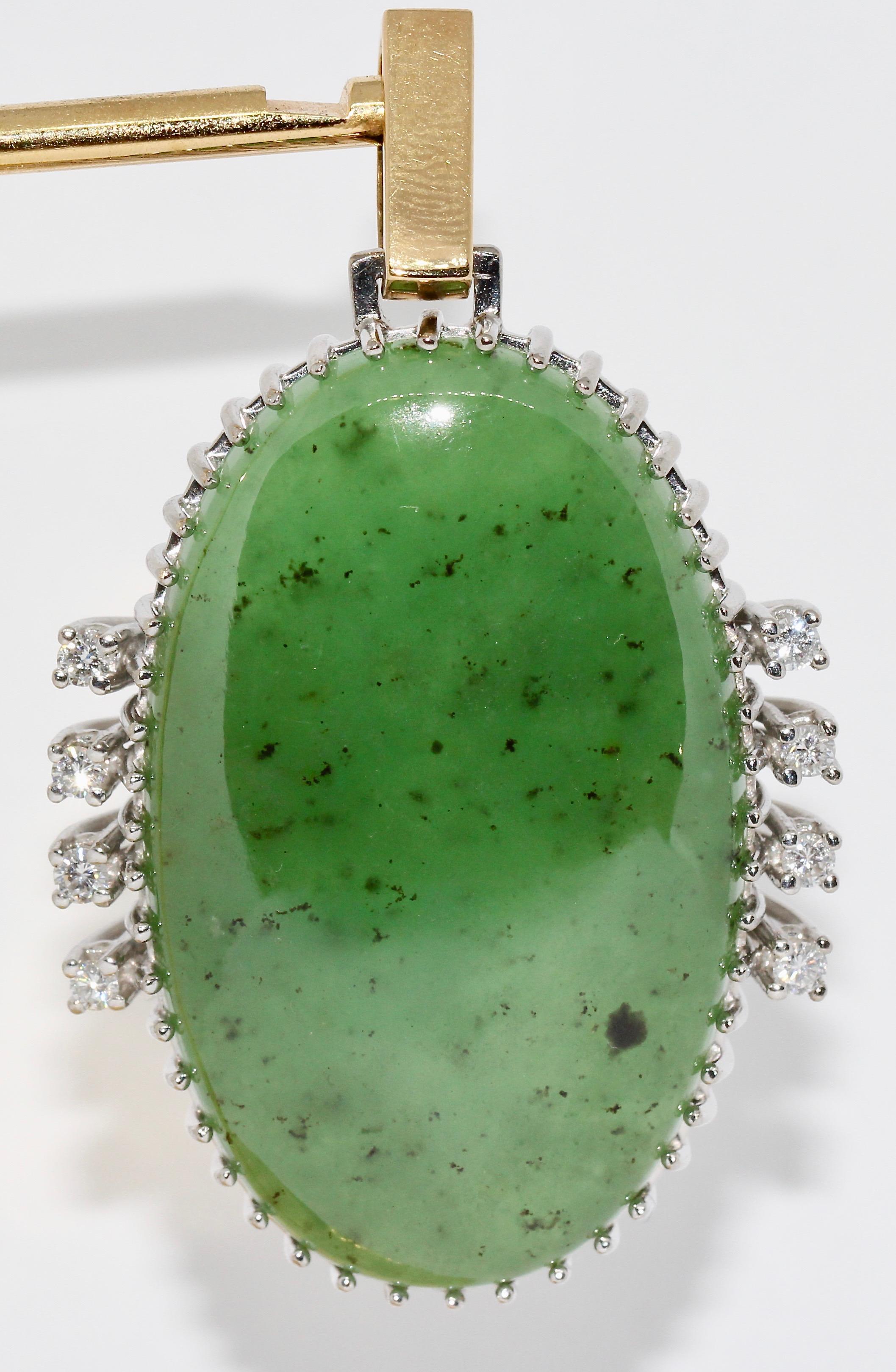 Big Jade Pendant, Enhancer, 18 Karat Gold with diamonds.

The eight diamonds have a very good clarity and white color.
Measured without the two eyelets.

You will find the matching necklace, ring and bracelet in our other offers.