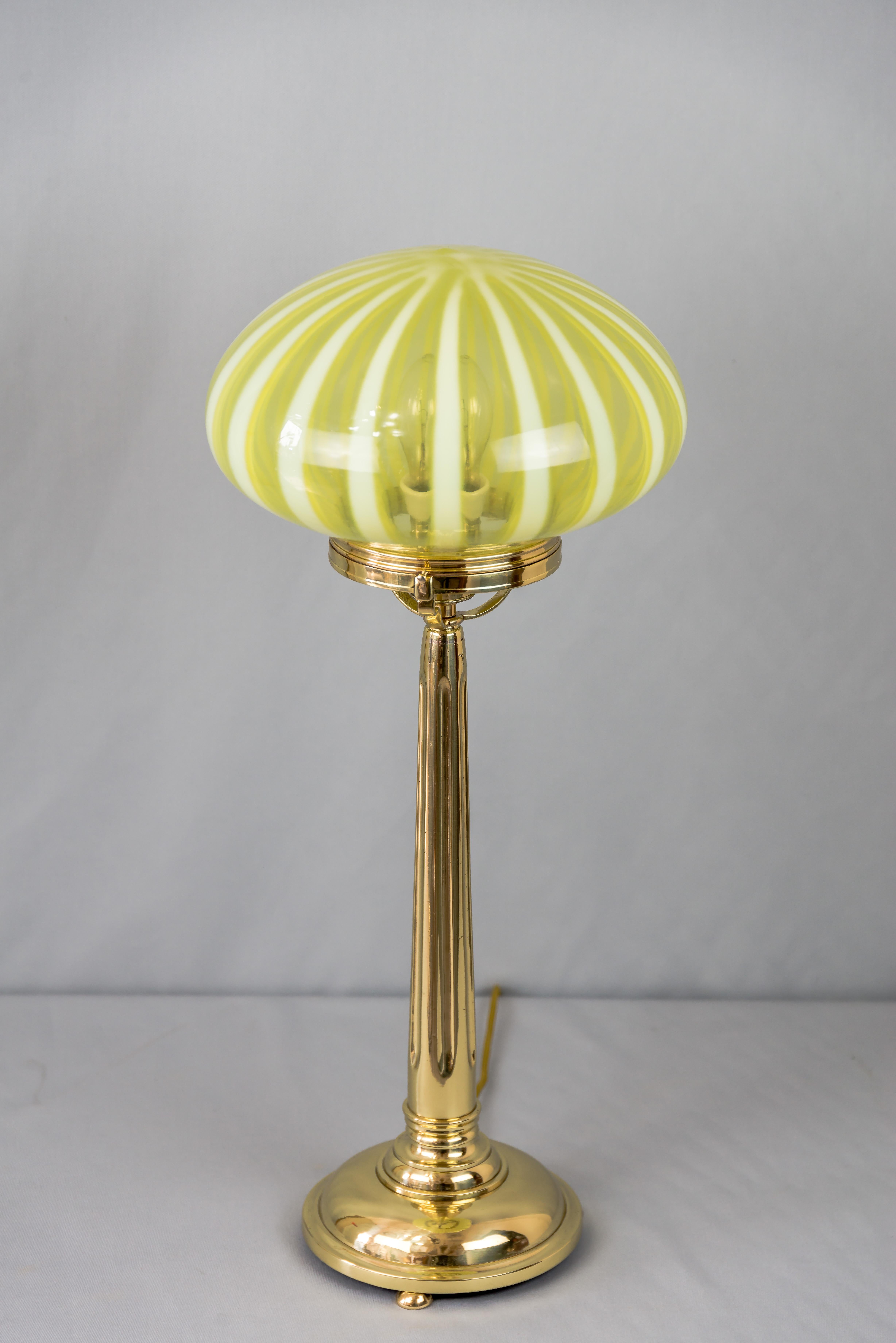 Big jugendstil table lamp with original opaline glass shade Vienna circa 1910s.
Polished and stove enameled.