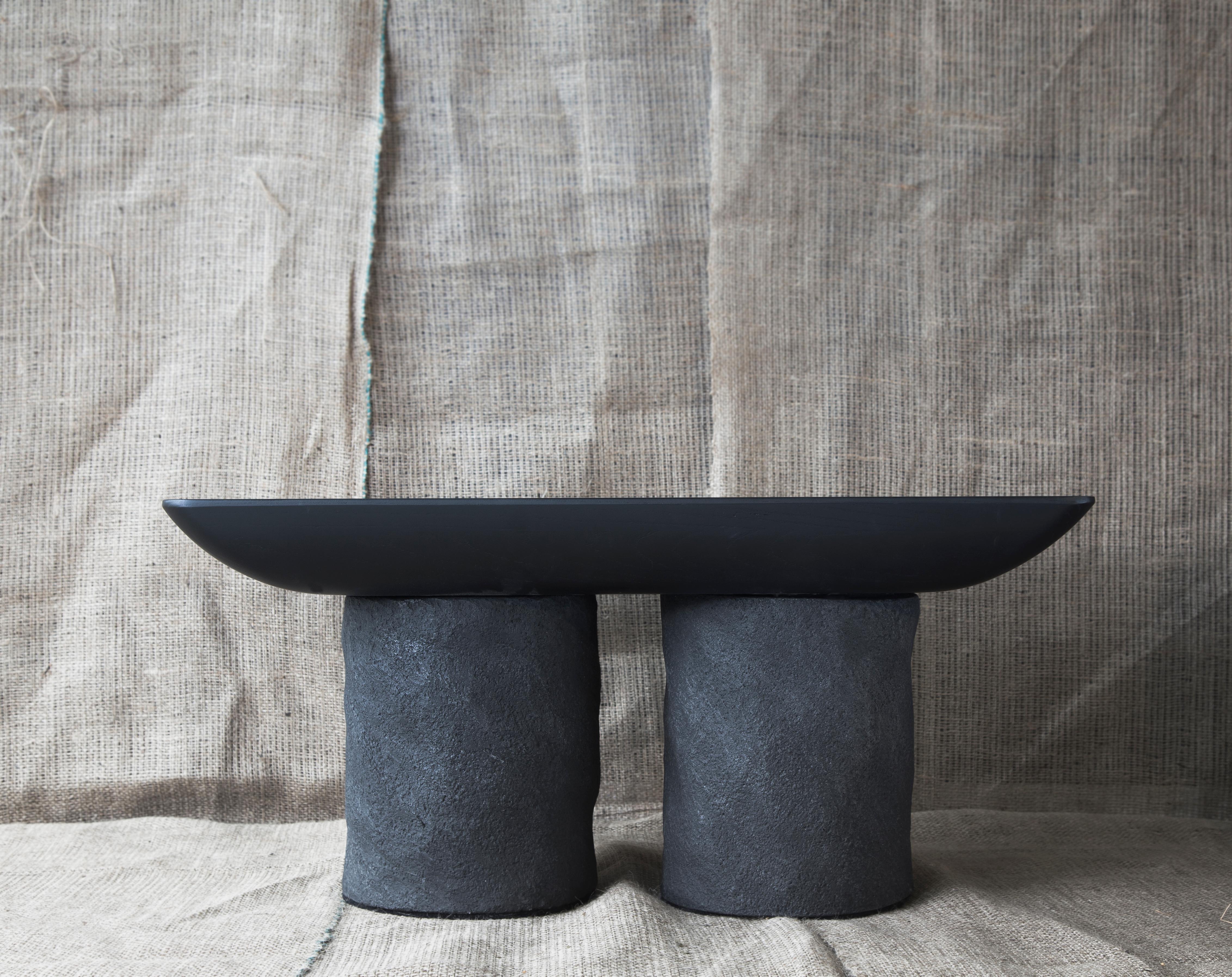 Big Korotun coffee table by Faina
Designed by Victoria Yakusha.
Dimensions: D 75 x W 42 x H 35 cm.
Material: Clay, Wood (Ash).

Made in the style of ethnic minimalism, the collection items introduce “naive design”- simple in form, yet with a deep