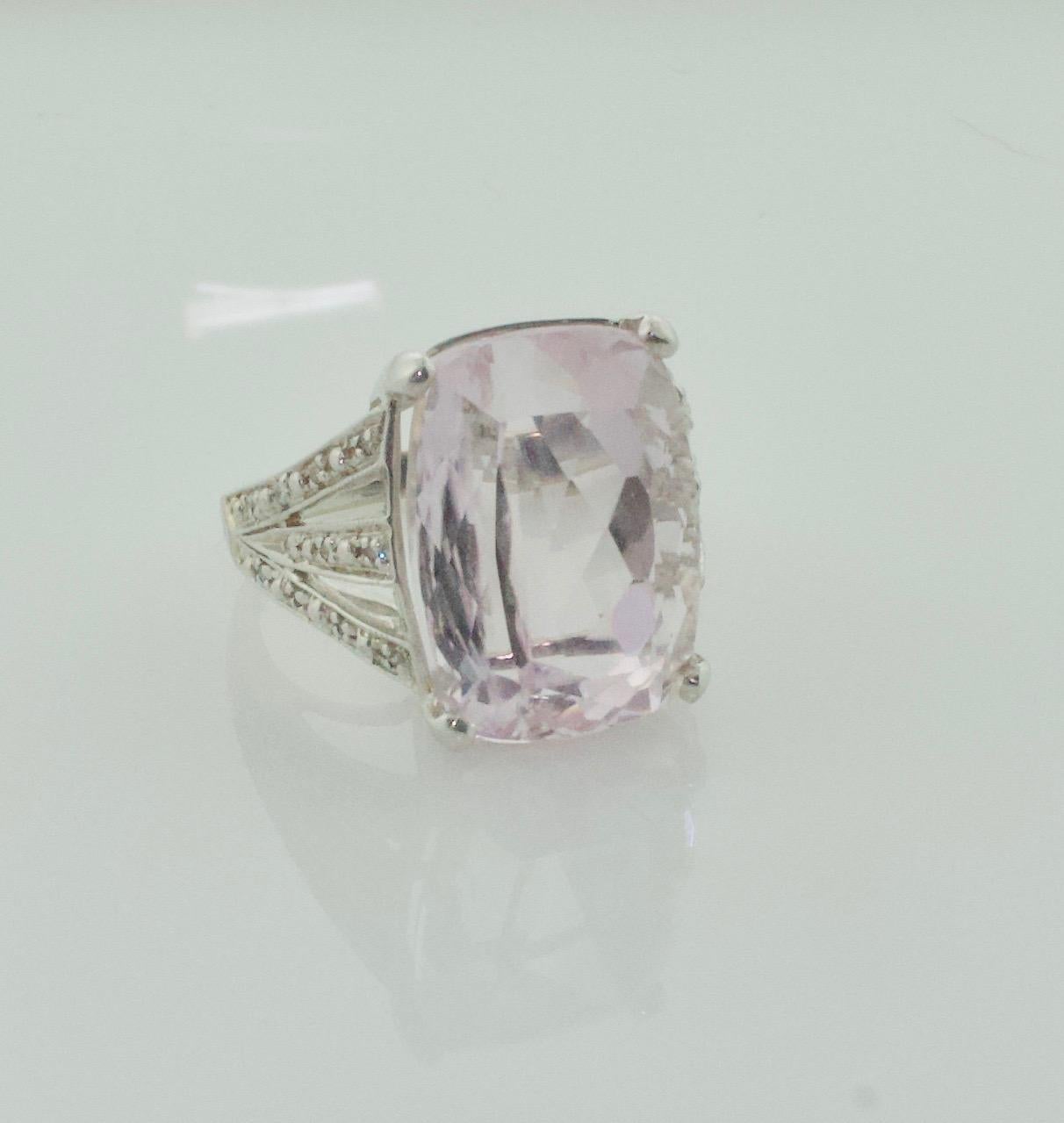 Big Kunzite and Diamond Ring in White Gold
One Cushion Cut Kunzite Weighing 26.00 Carats Approximately [bright with no imperfections visible to the naked eye]
26 Round Brilliant Cut Diamonds Weighing .15 Carats Approximately 