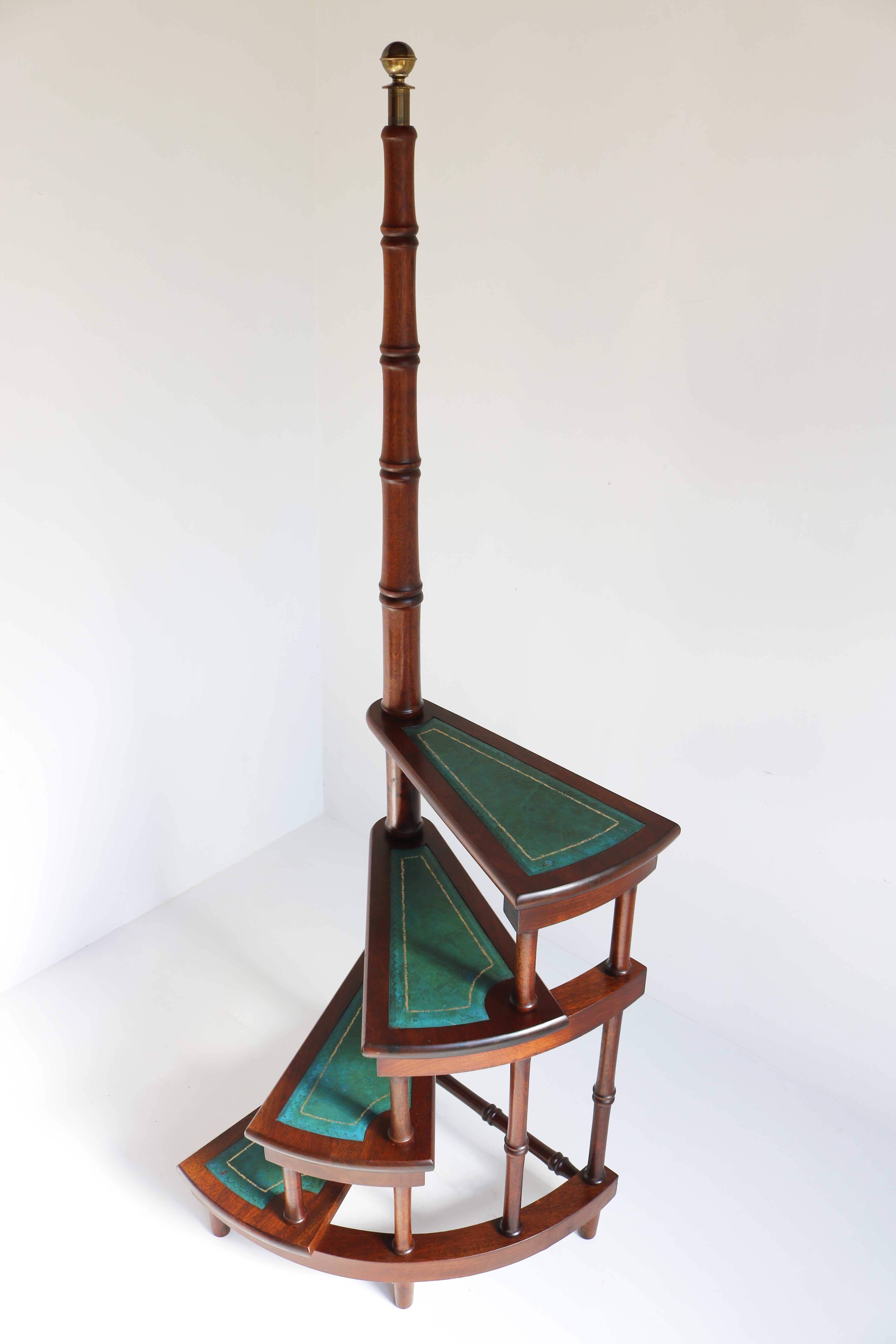 Impressive & luxurious 1960s old classic Library steps, 
the circular step ladder features four stairs rolled around a central post embellished with a decorative brass finial at the pediment.
Each step is upholstered with the original leather