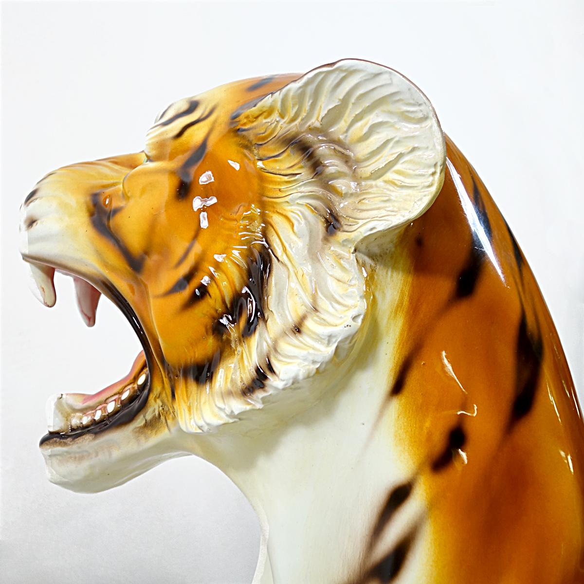 Very big statuette of a sitting tiger made of ceramic. It is almost one meter (approx. three feet) high.
It could very well have been produced by the Italian manufacturer Ronzan. It is marked Made in Italy.