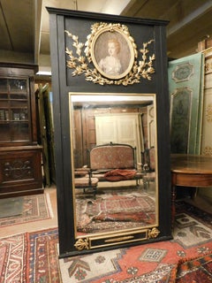 Big Mirror black lacquered wood, gilded carvings and painting dame, Italy