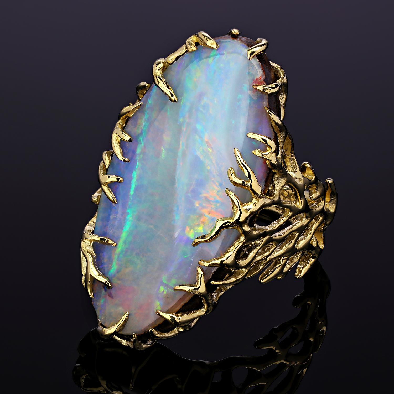 Natürlicher Boulder Opal 14K Gelbgold Ring 

Opal Herkunft - Australien

Opal Abmessungen - 0.16 х 0.59 х 1.18 in / 4 х 15 х 30 mm

Gewicht des Steins - 16.50 Karat

Ringgewicht - 10.44 Gramm

Ringgröße - 6.5 US