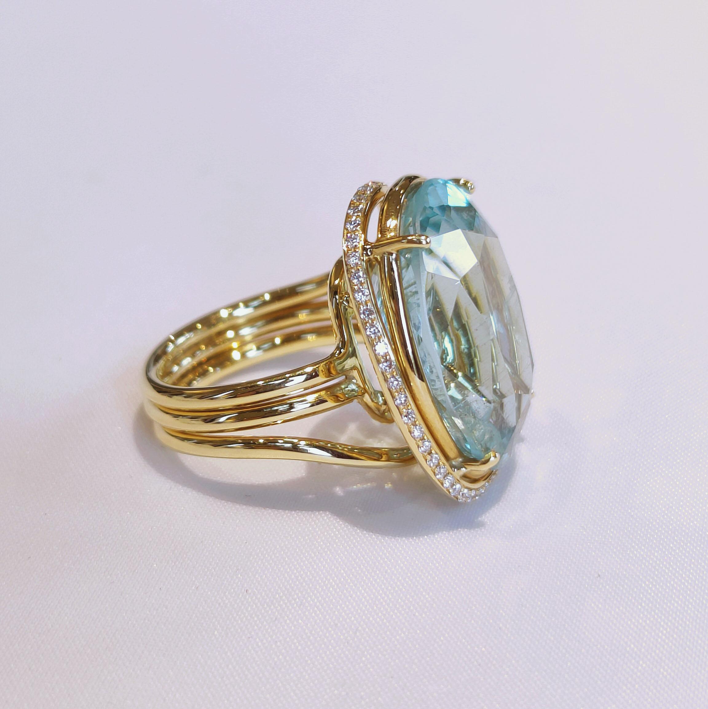 Contemporary Big Oval Cut Aquamarine Ring in 18 Karat Yellow Gold and Diamonds