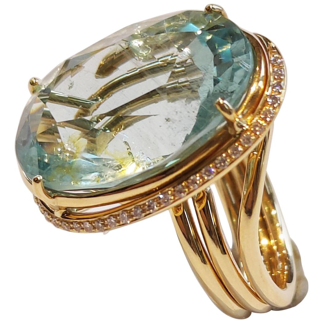 Big Oval Cut Aquamarine Ring in 18 Karat Yellow Gold and Diamonds
