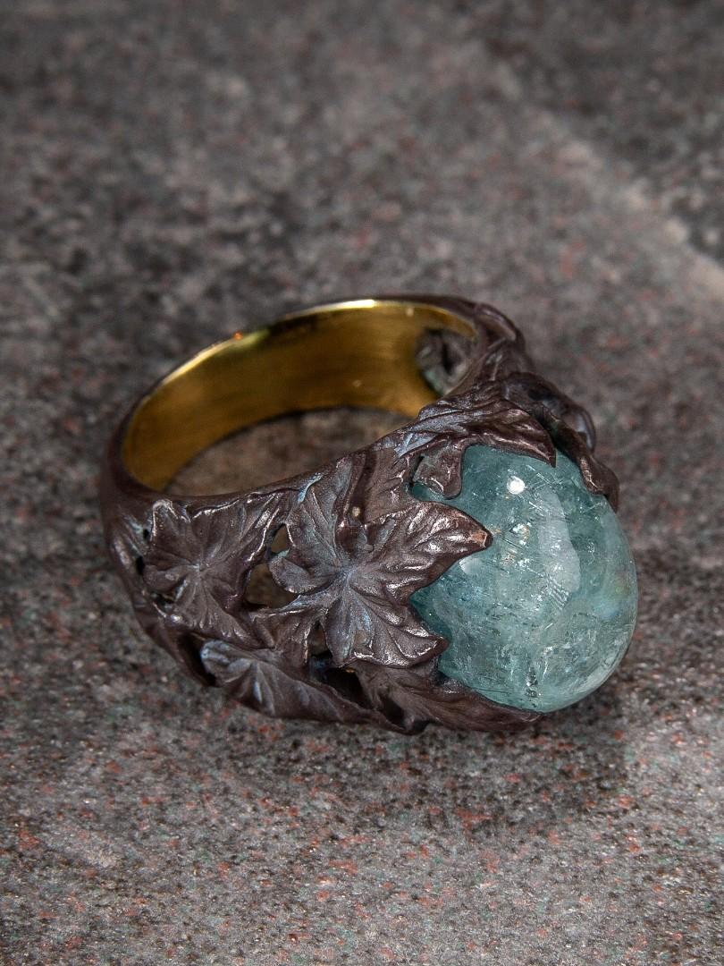 Big patinated and gold plated silver ring with cabochon of natural Aquamarine blue Beryl
aquamarine weight - 16.15 carats
aquamarine measurements - 0.39 x 0.43 x 0.59 in / 10 х 11 х 15 mm
ring weight - 12.65 grams
ring size - 7.75 US

Ivy