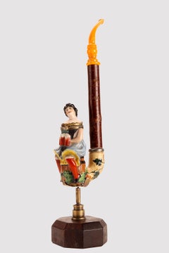 Big porcelain pipe: a waitress holding mugs of beer, Germany 1880.