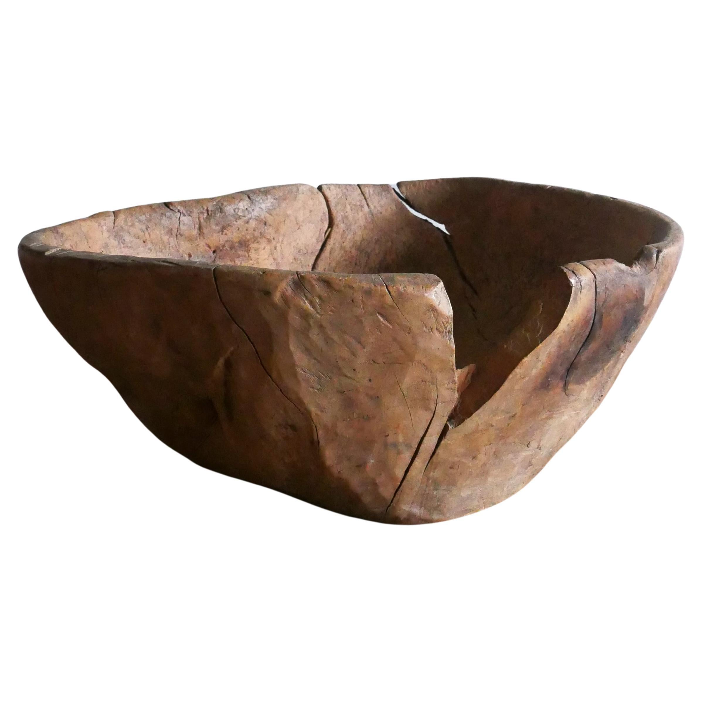 Really big primitive wooden bowl from Sweden, made in 1832 .

It’s heavy patinated over the years and it has a lovely patina, maker marks on the bottom and date. 
