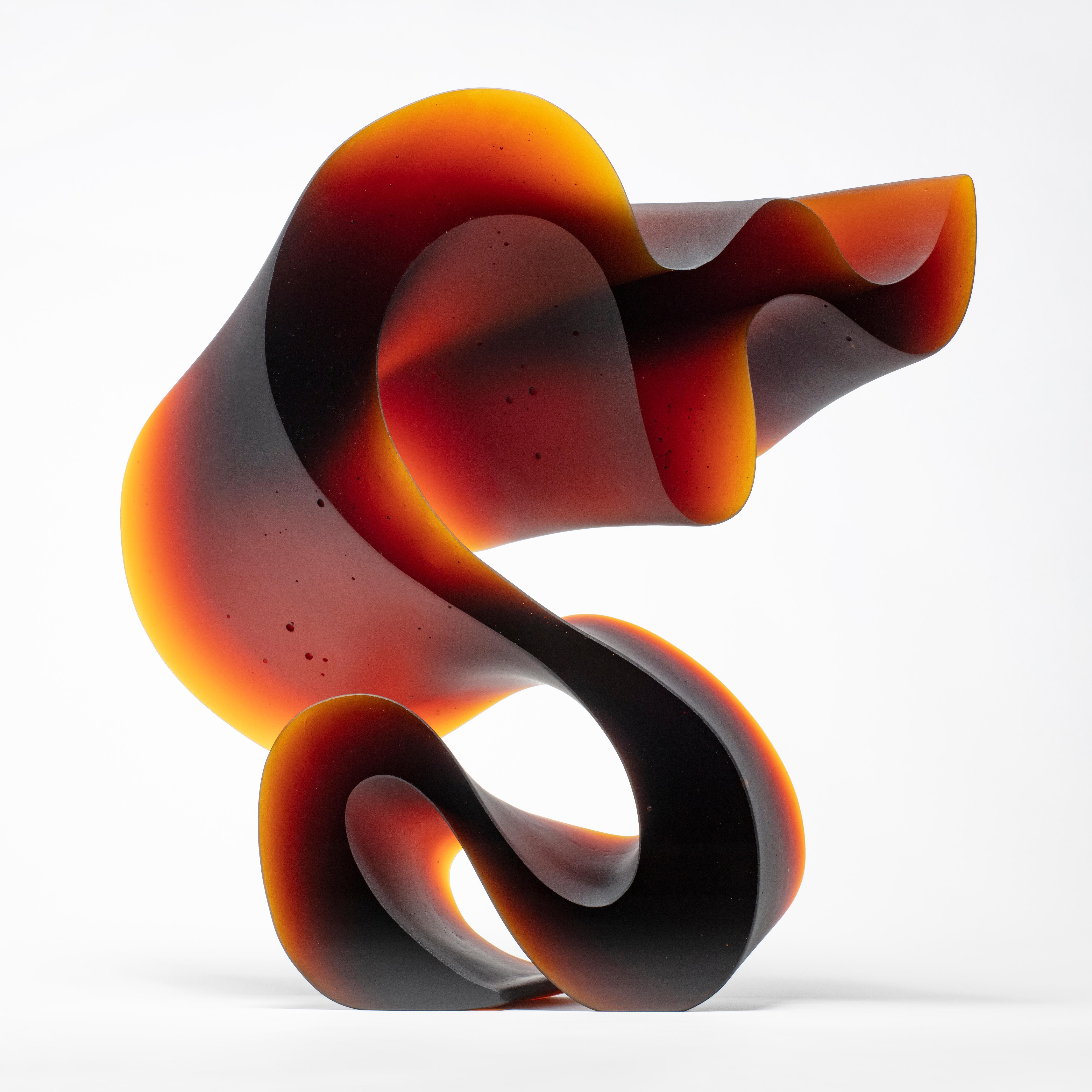 Big red line is a unique cast glass sculpture in amber / red glass, created by the Danish artist Karin Mørch. Dramatic sweeping curves Meander and follow the beautiful lines of this heavy and solid cast piece. Mørch intimately understands her glass