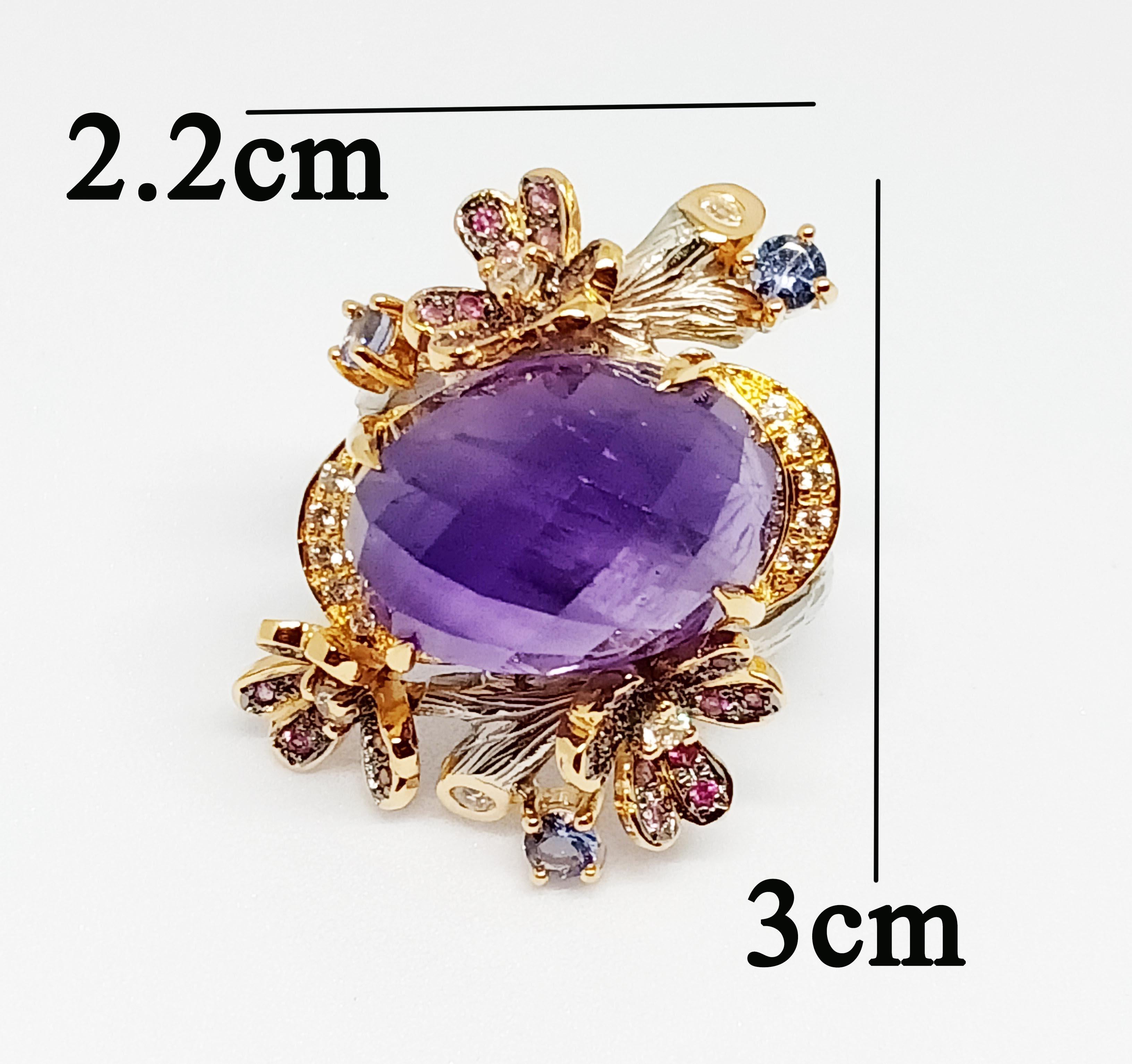 Amethysts Oval checkkerboard  (17.30cts)  size 18x13 mm.
Pink sapphire size 1.3 mm. 36pcs. pave setting in Black rhodium Plated 
Tanzanite Round size 3.0 mm. 3 pcs
White Zircon Round 1.25 mm. 10 pcs.
White Zircon Round 1.50 mm. 3 pcs.
White Zircon