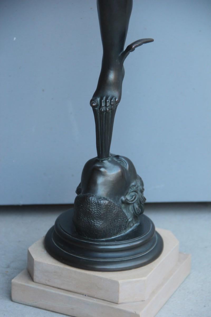 Big sculpture Mercurio di Gianbologna 1930 metal marble black Sephyrus.

Mercury is placed with the left foot on the wind generated by the mouth of Zephyrus. The messenger of the gods is in fact about to take flight thanks to the wings that are