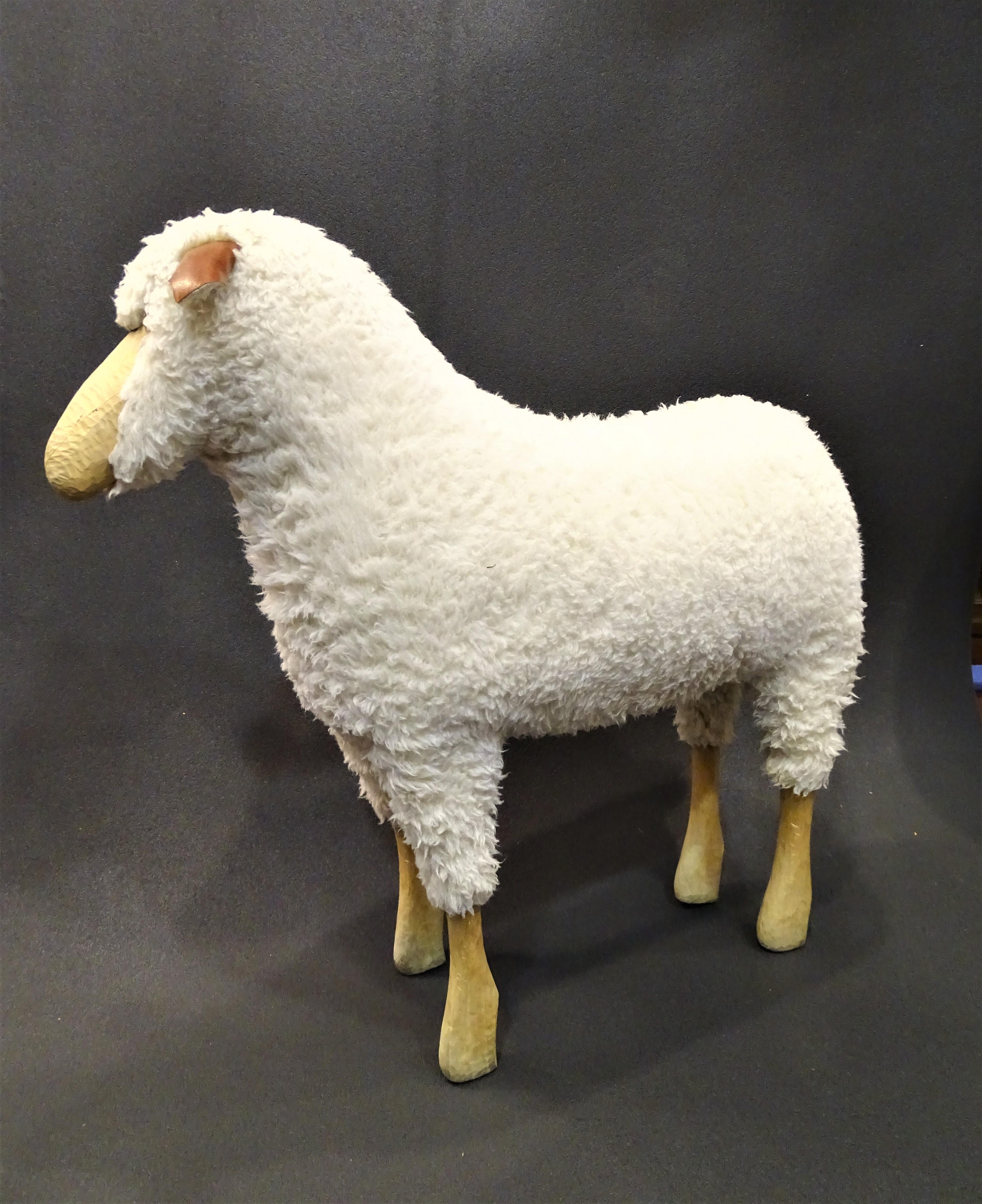 Gorgeous big stool sheep by Hamms-Peter Krafft, original ,80s, in a very good condition.
Beautifully made wooden sheep with real soft, fluffy sheepskin, made with beech legs, leather ears, sheepskin coat and glasseyes. The sheep is strong enough to