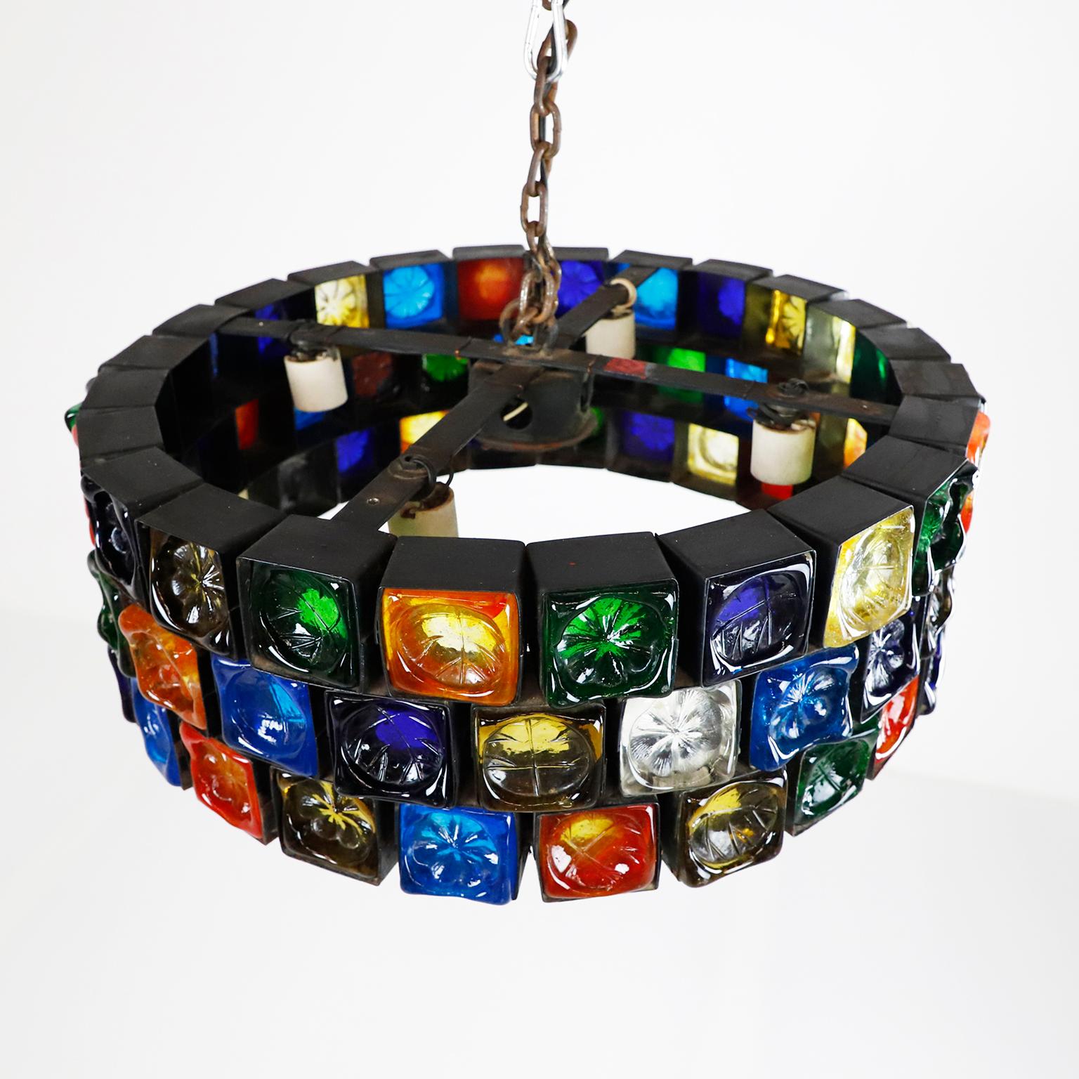 We offer this big size chandelier, made of steel and multicolored blown glass in fantastic vintage conditions, each cube is handwrought in steel which cradles the thick sculptured glass, the chandelier have 72 cubes of glass measures 6 x 6 cm, circa