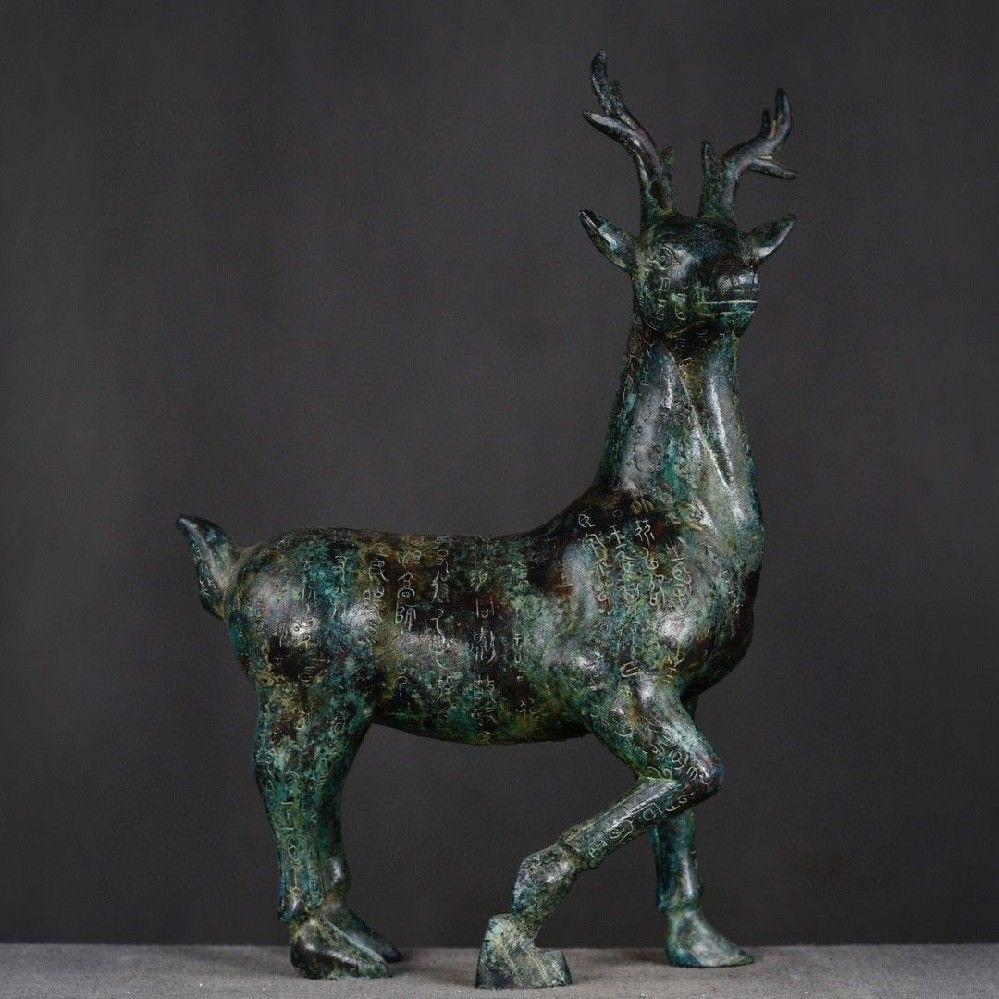 This large-sized Old Chinese Bronze Deer Statue features a majestic standing deer, crafted in intricate detail with full body characters, showcasing the strength and grace of this noble animal. The bronze craftsmanship highlights the fine detailing