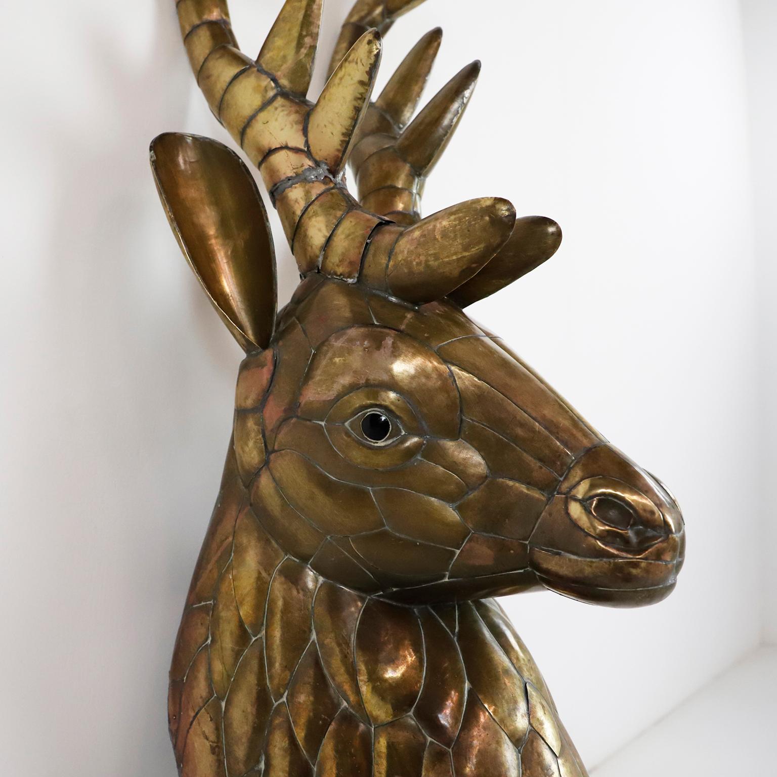 Mounted Stag head made in brass, cut bent and assembled, circa 1960.

Sergio Bustamante is a Mexican Artist and sculptor. He began with paintings and papier mache figures, inaugurating the first exhibit of his works at the Galeria Misrachi in