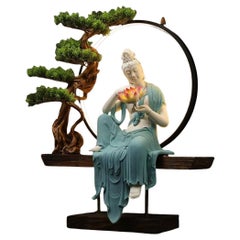 Modern Big White Porcelain Sitting Buddha in Blue Robe Holding a Lotus Flower