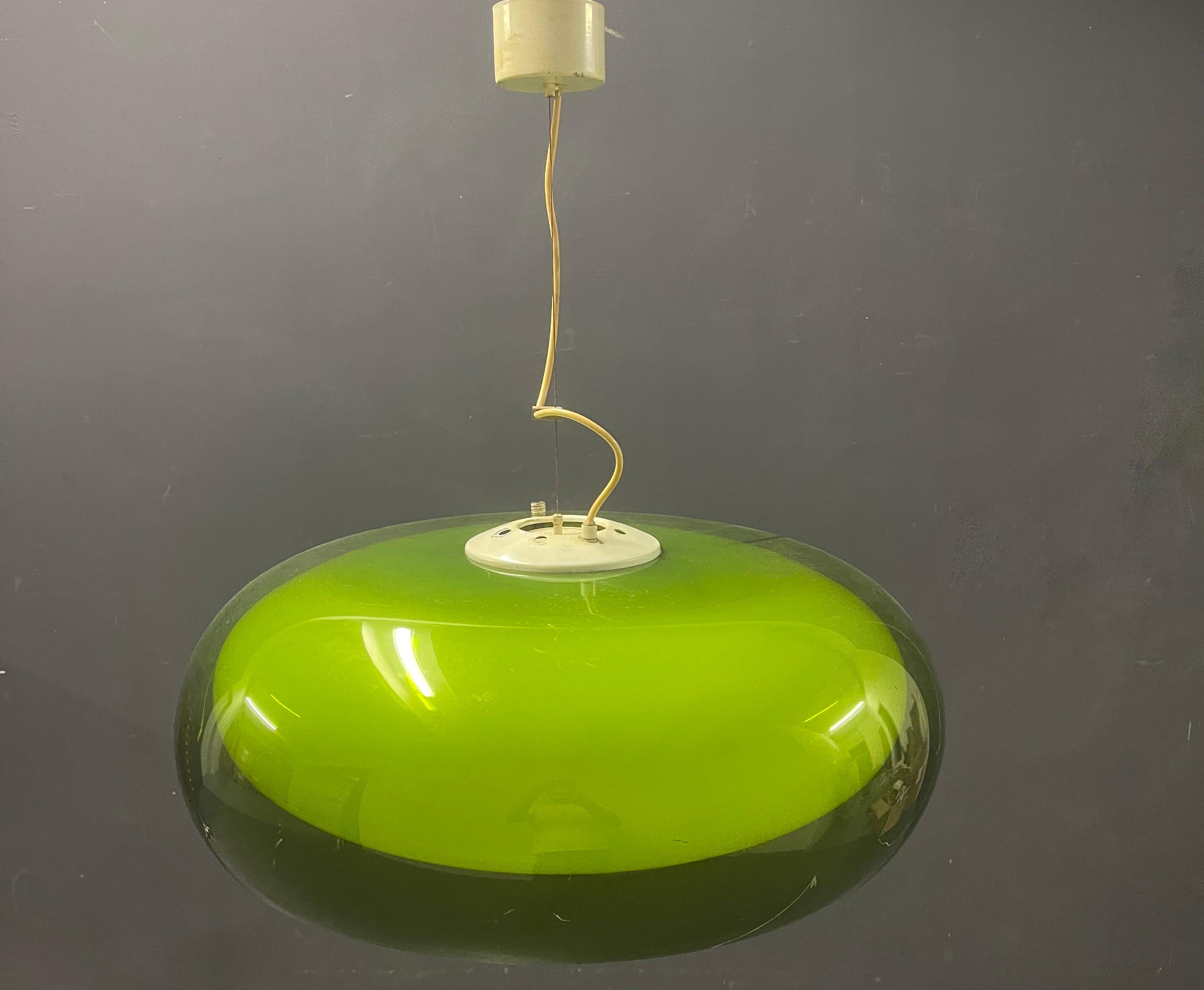 Very nice and modern pedant by Stilnovo. The ufo lamp in glass is quite common, but we never saw this beauty with green acrylic shade. Does add a very fresh effect. 
The lamp can be hung straight or croocked.