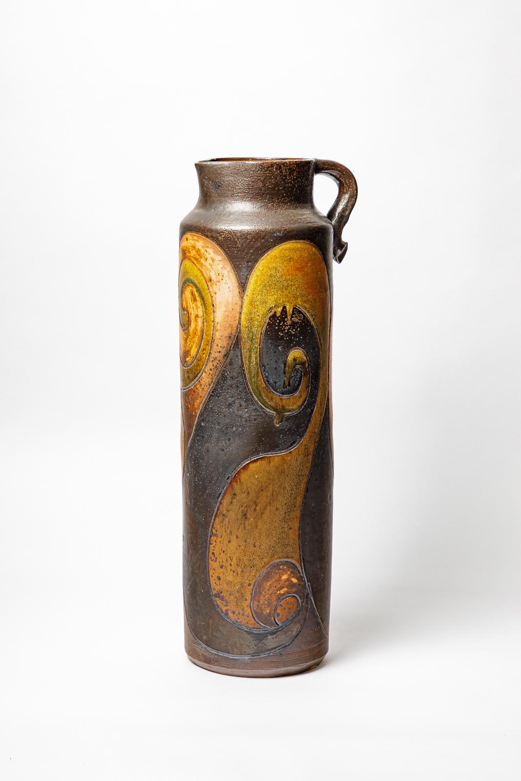 Big stoneware pitcher by Georges Martin with geometrical decoration.
Artist monogram on the base. 
Unique piece.
Circa 1970-1980.
H : 24.4 x 7.1 x 8.3 inches.
