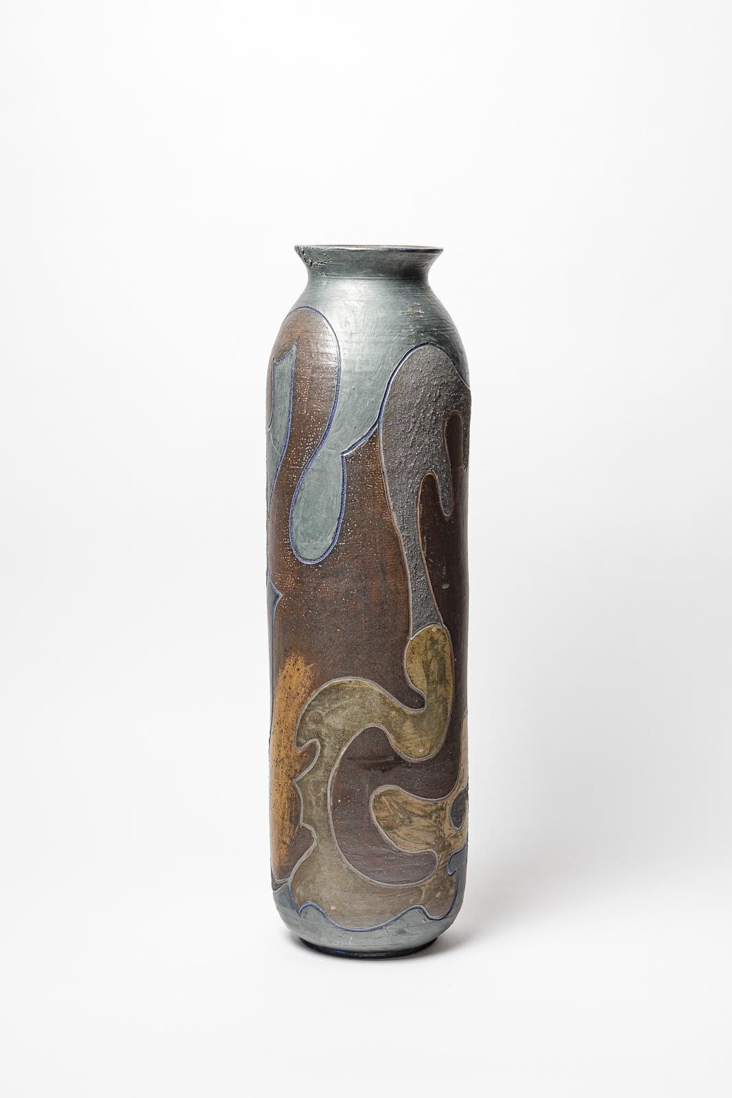 Stoneware vase by Georges Martin with geometrical decoration.
Artist monogram on the base. 
Circa 1970-1980.
Unique piece.
H : 23.6 x 6.1 x 7.5 inches.