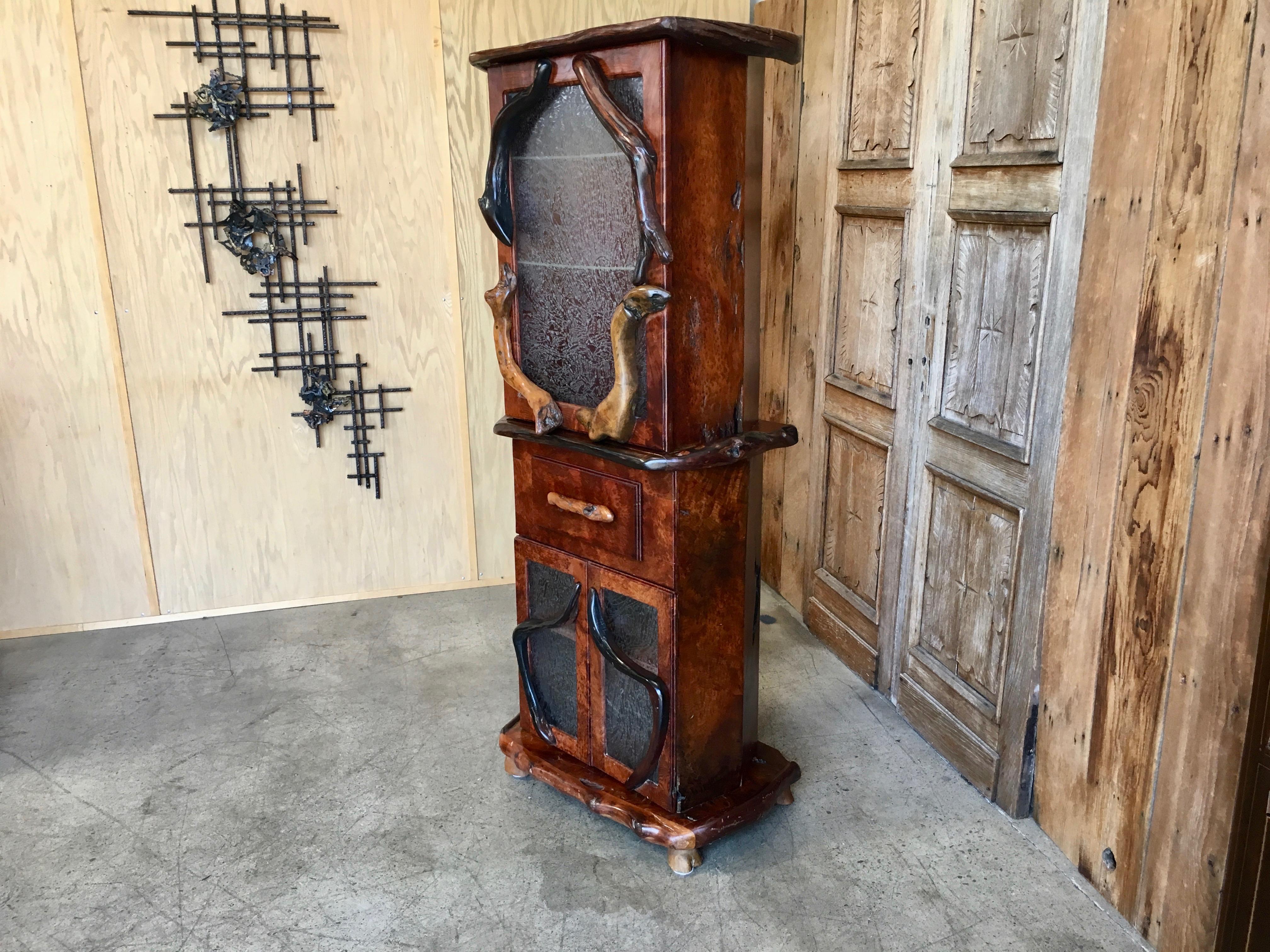 Massive redwood planks make this cabinet very impressive with original (glue chip glass) that has a nice organic design and twisted branch handles.
