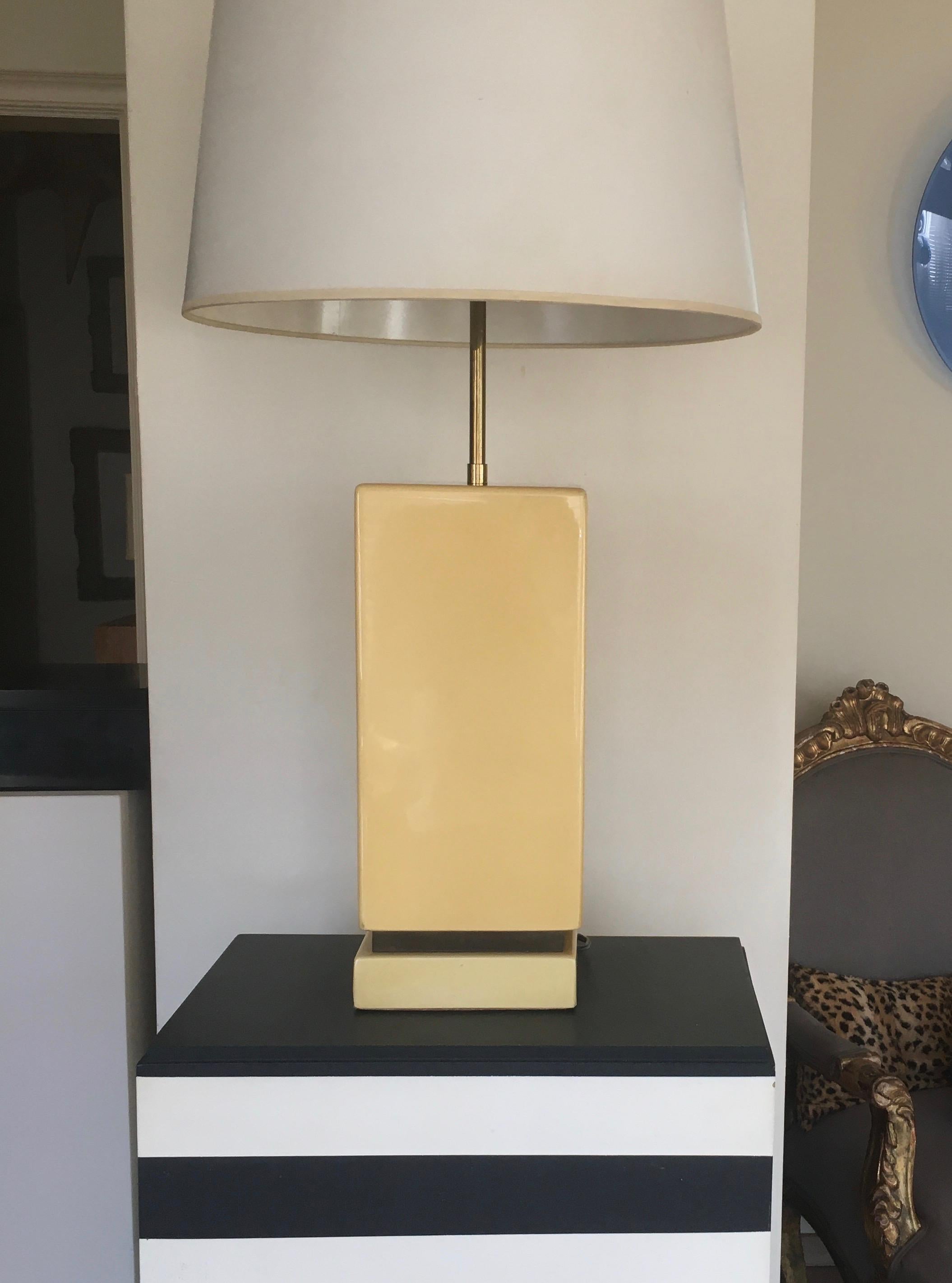 Varnished big lamp with brass details, adjustable with two lights.
By Aldo Tura around 1975.
Unsigned.