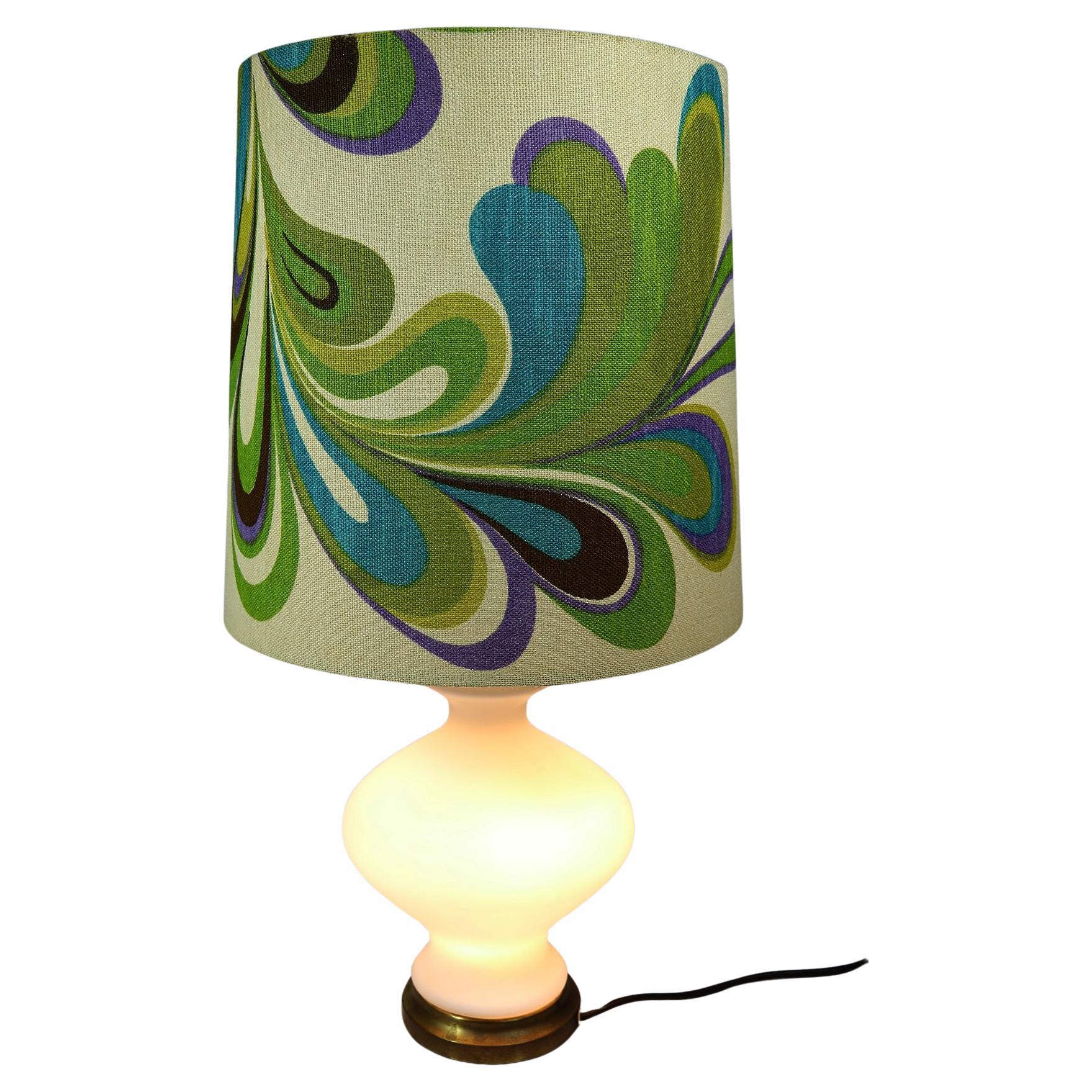 Floor lamp or large table lamp with large lampshade in Pop Art decor and linen look.
 
White glass base, illuminated.

Total height: 81 cm / 31.9 inch
Diameter lampshade: 40 cm / 15.7 inch
 
Manufacturer unknown, could be Doria.
 