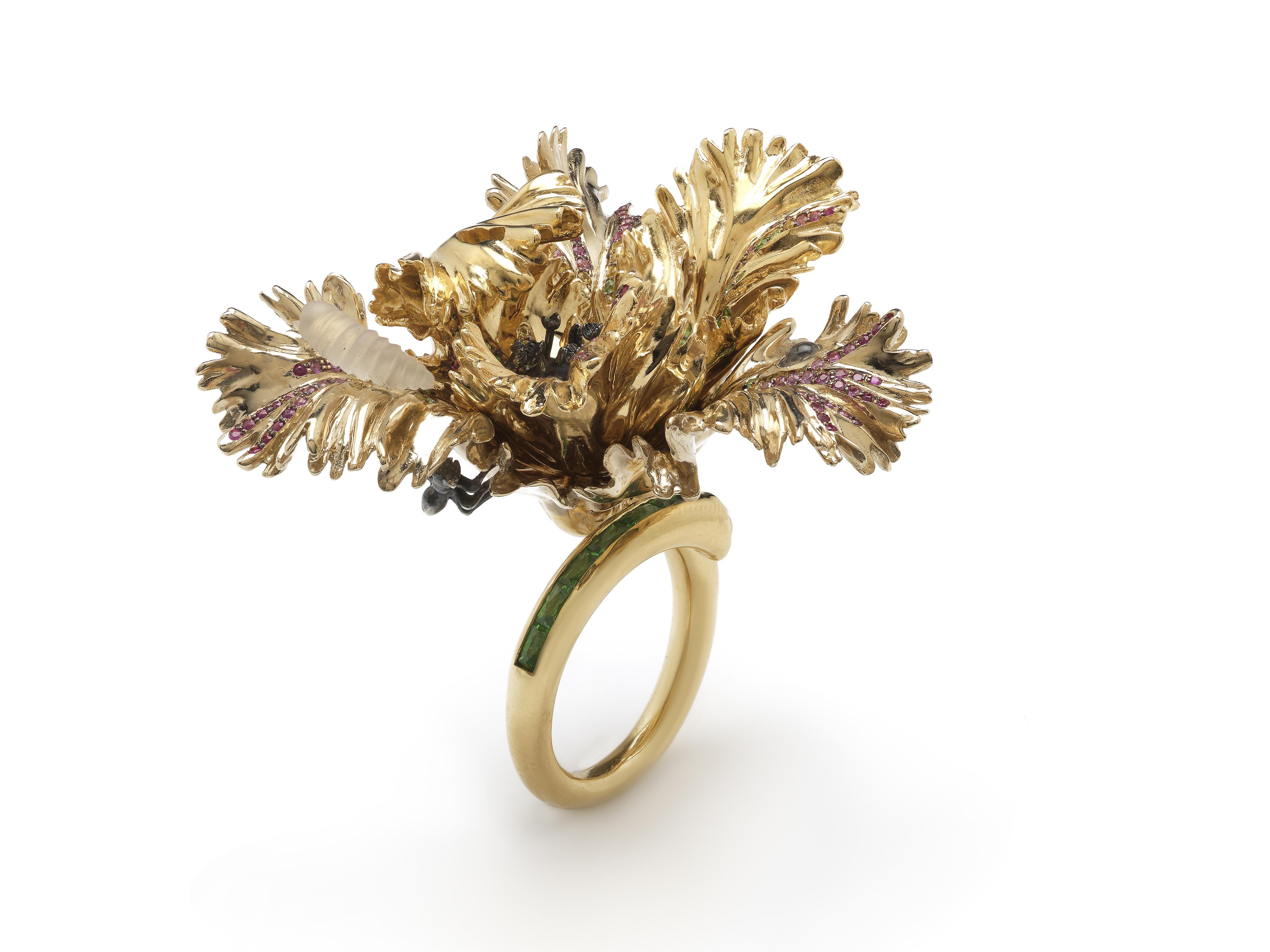 Inspired by the flamboyant beauty of the Parrot Tulip, the Big Tulip Ring blooms on the hand, for a unique take on a cocktail ring.

The ring’s petals are designed in 18k white and yellow gold with blackened gold detailing, and embellished with pink
