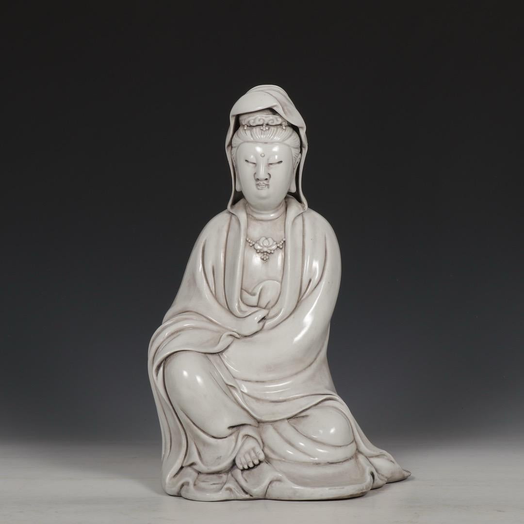 Big Vintage Chinese White Glazed Sitting Guan Yin Buddha Statue – A Symbol of Compassion and Serenity

This Big Vintage Chinese White Glazed Guan Yin Statue depicts the Goddess of Mercy, gracefully seated in a meditative and compassionate pose. Guan