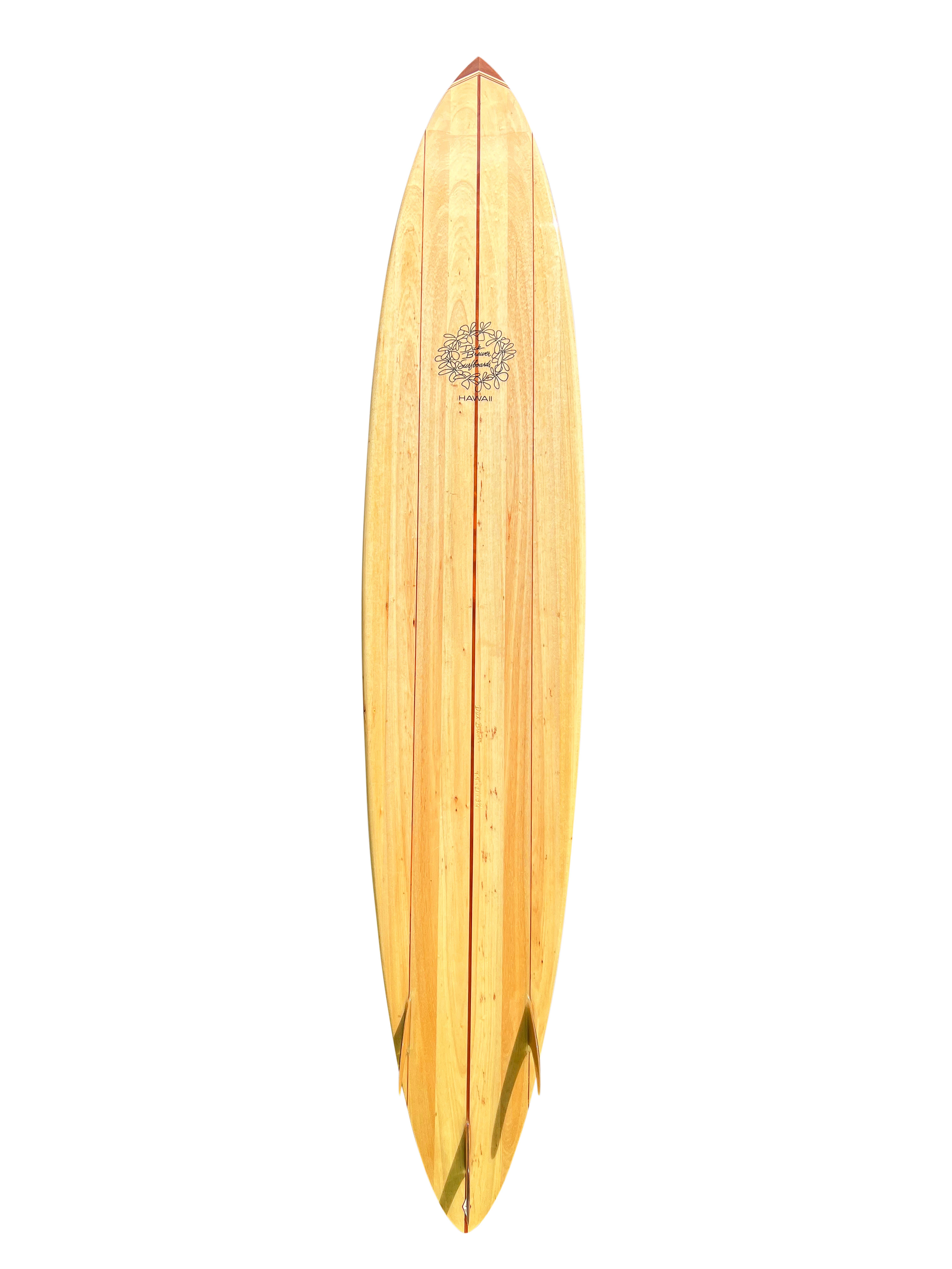 Big wave balsawood pintail surfboard shaped by the late Dick Brewer (1936-2022) in the early 2000s.  Features tri-stringer design with beautiful Hawaiian koa wood fins and 10 piece wood nose block. A remarkable example of a balsa surfboard shaped in